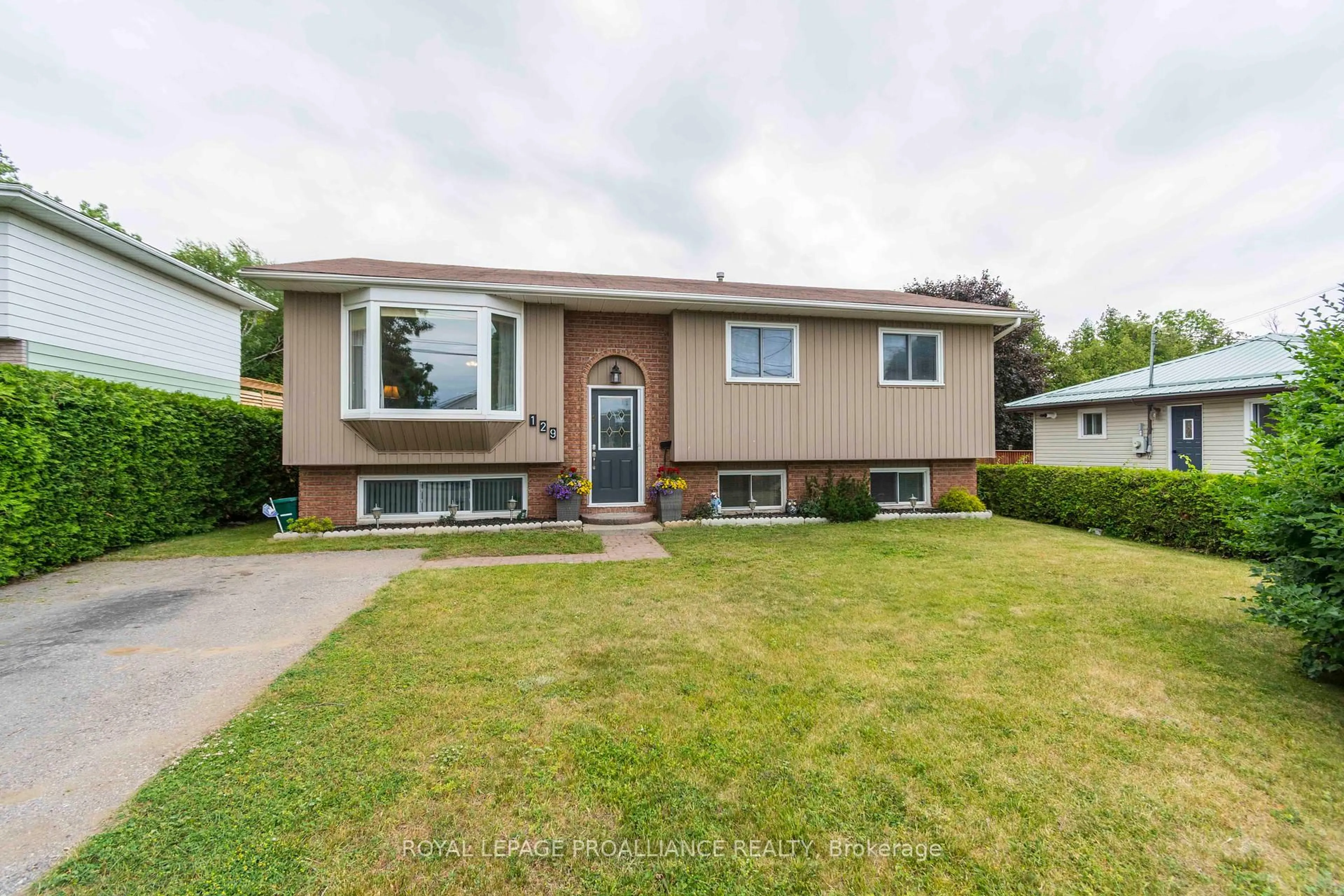 Home with vinyl exterior material, street for 129 Cedar St, Brighton Ontario K0K 1H0