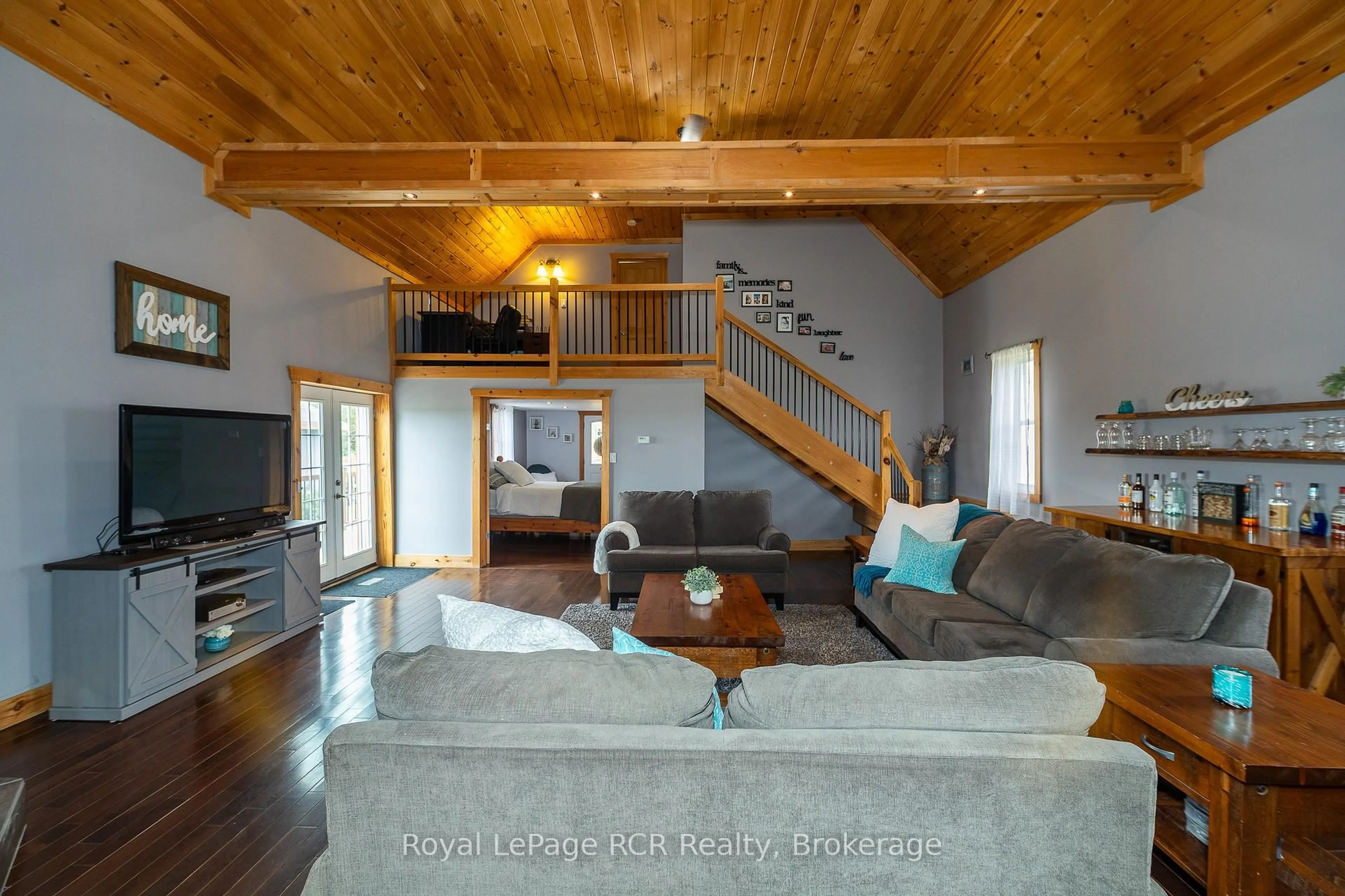 Living room with furniture, wood/laminate floor for 406428 Grey Rd 4, Grey Highlands Ontario N0C 1E0