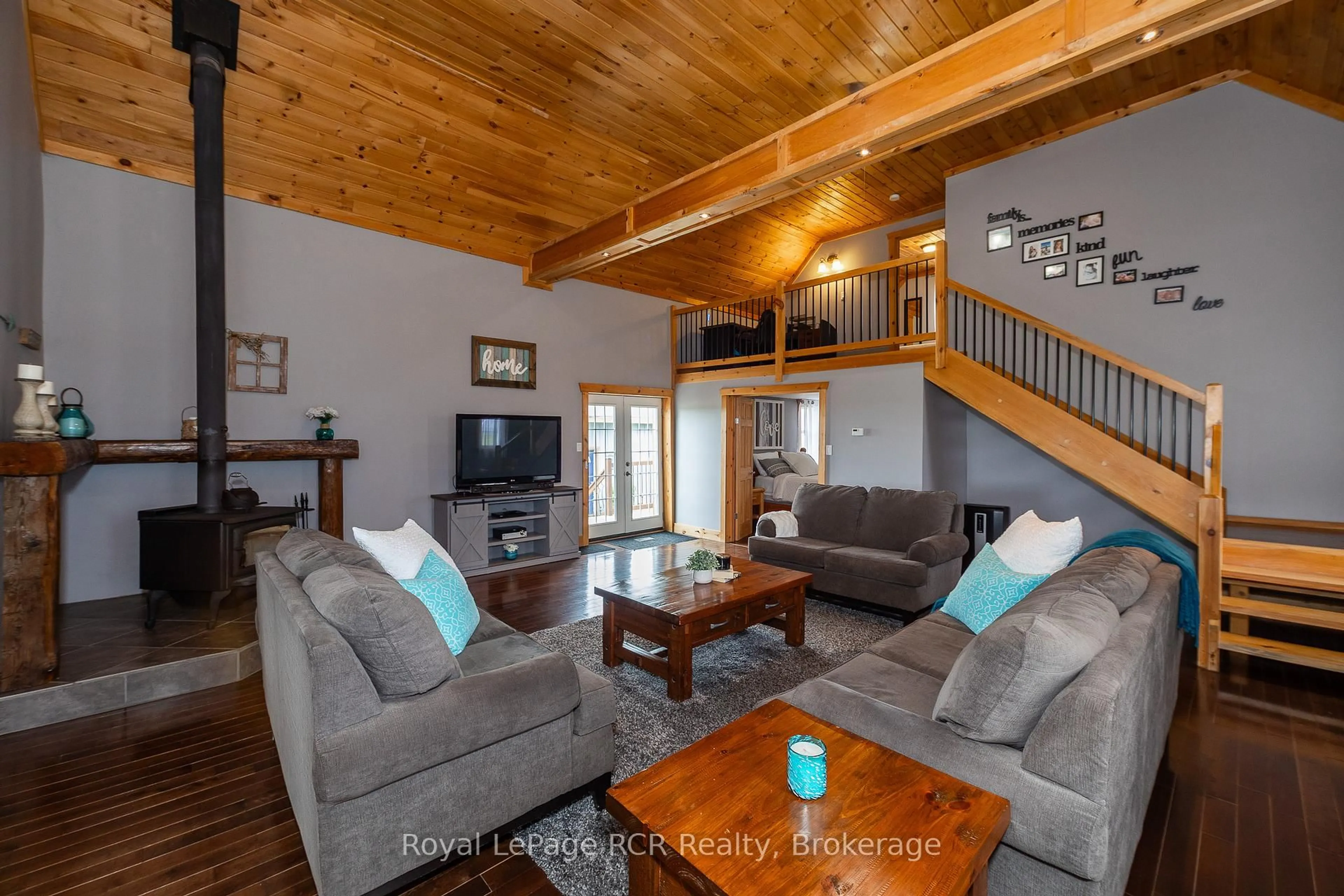 Living room with furniture, wood/laminate floor for 406428 Grey Rd 4, Grey Highlands Ontario N0C 1E0