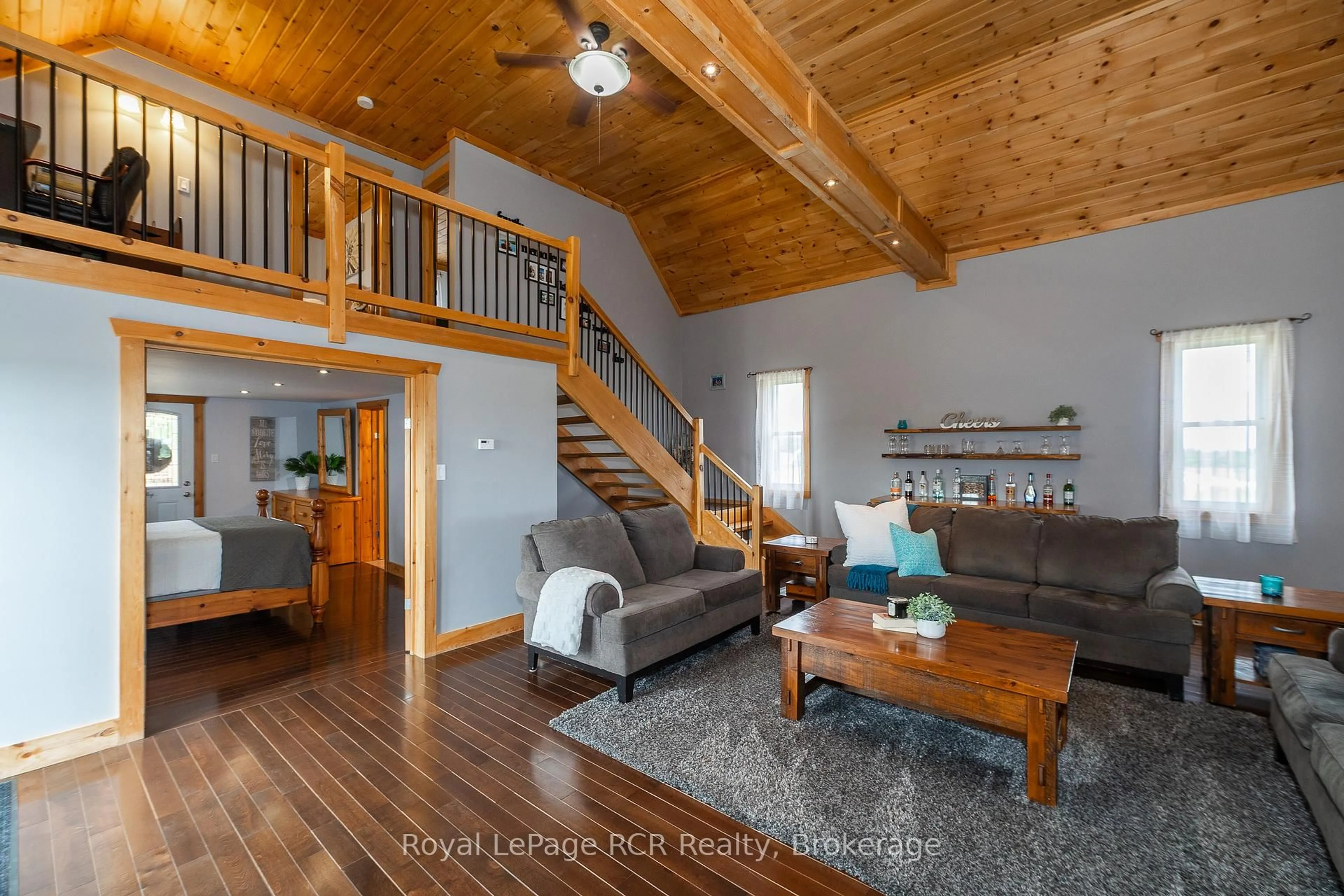 Living room with furniture, wood/laminate floor for 406428 Grey Rd 4, Grey Highlands Ontario N0C 1E0