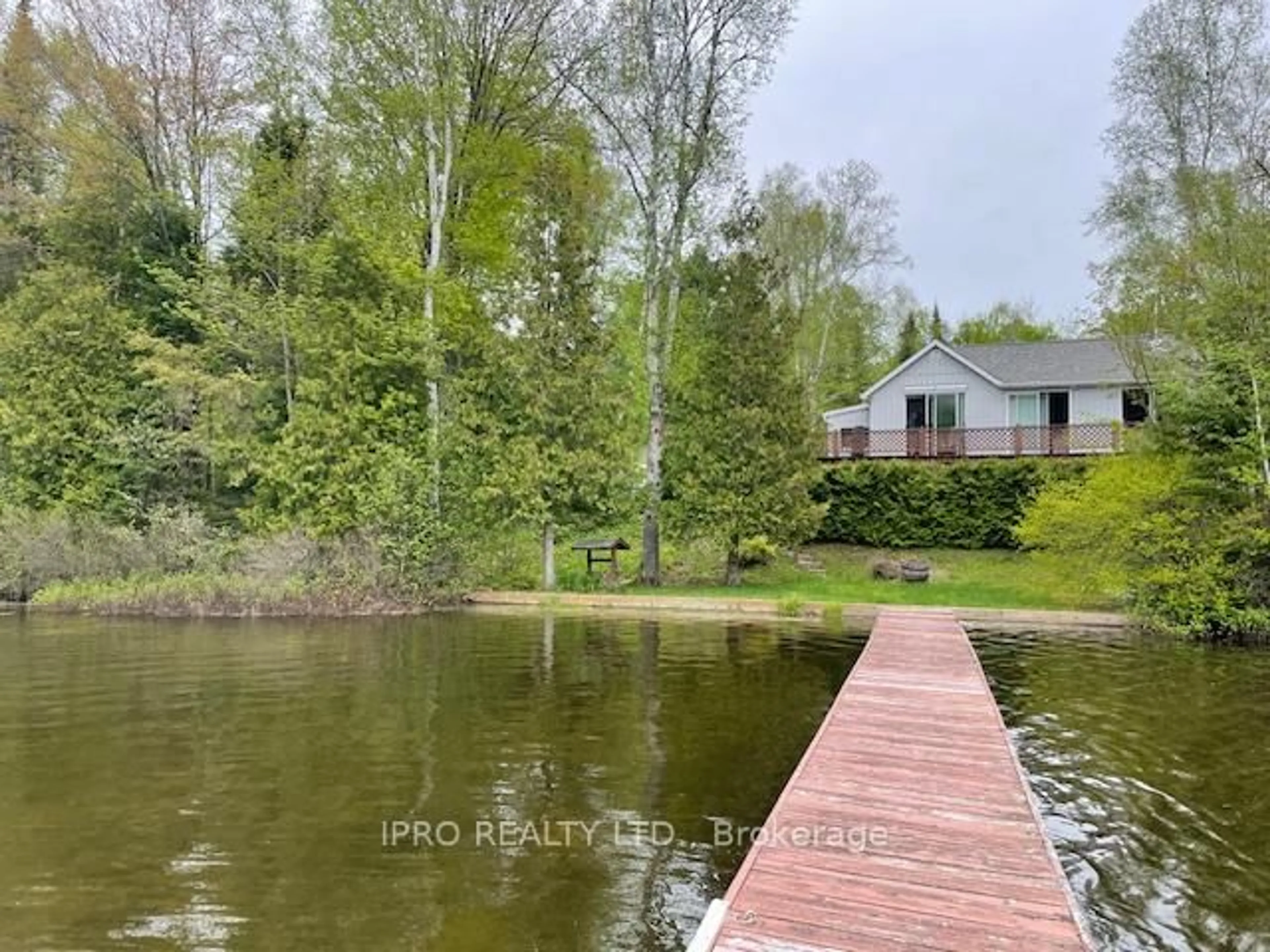 A pic from outside/outdoor area/front of a property/back of a property/a pic from drone, water/lake/river/ocean view for 1091 Brenholm Lane, Highlands East Ontario K0L 3C0
