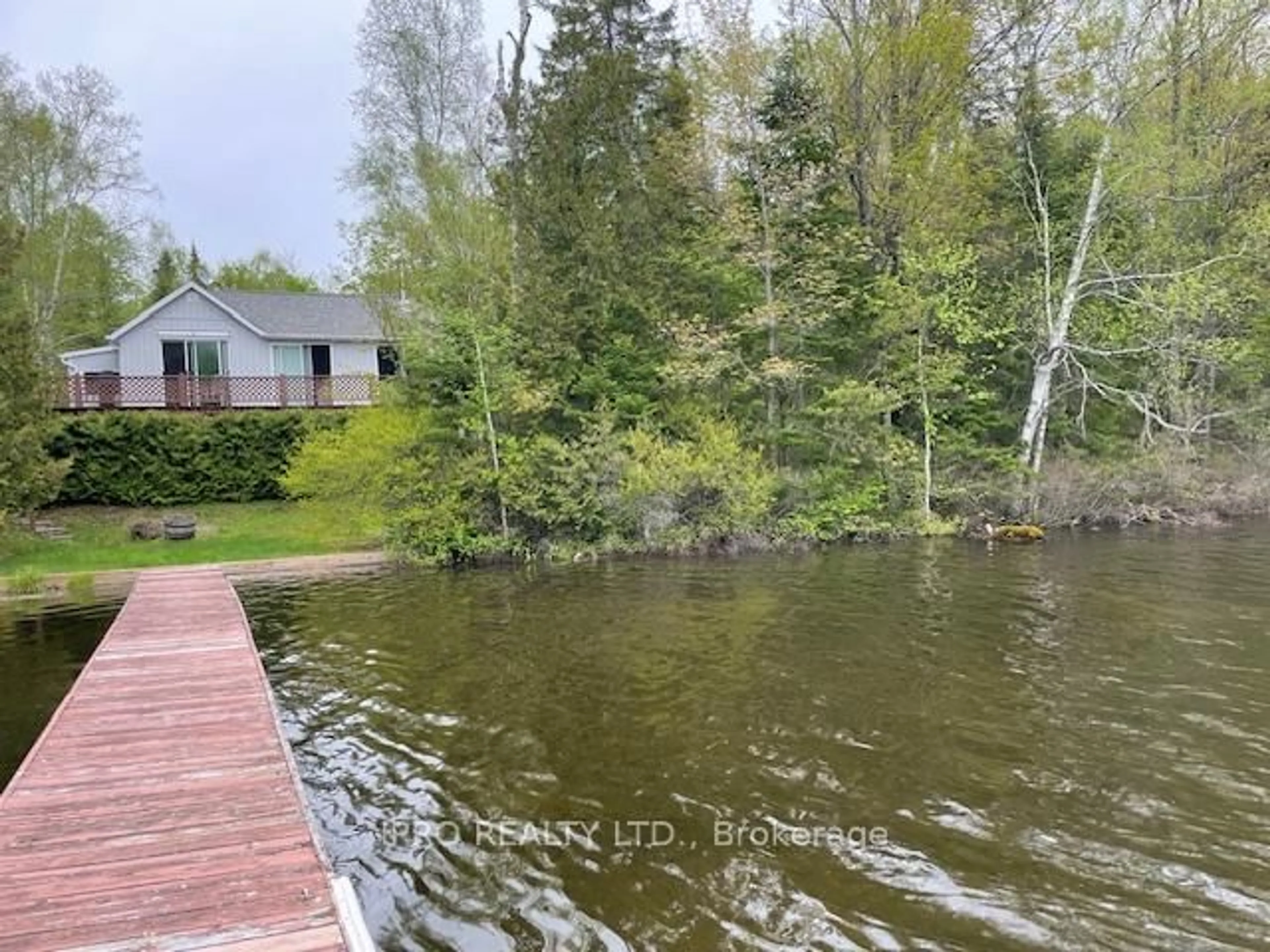 A pic from outside/outdoor area/front of a property/back of a property/a pic from drone, water/lake/river/ocean view for 1091 Brenholm Lane, Highlands East Ontario K0L 3C0