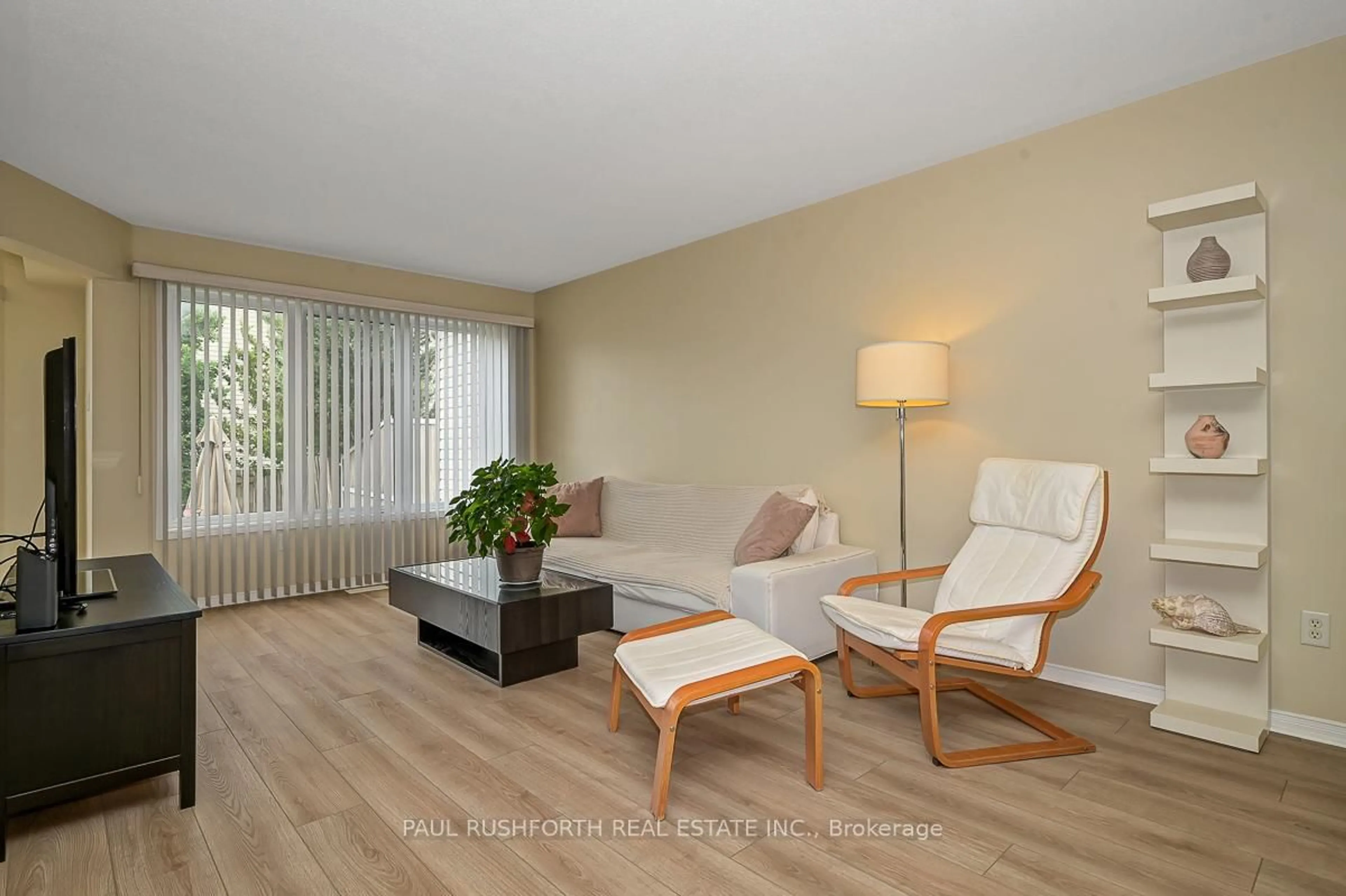 Living room with furniture, wood/laminate floor for 611 Aquaview Dr, Orleans Ontario K4A 4W1
