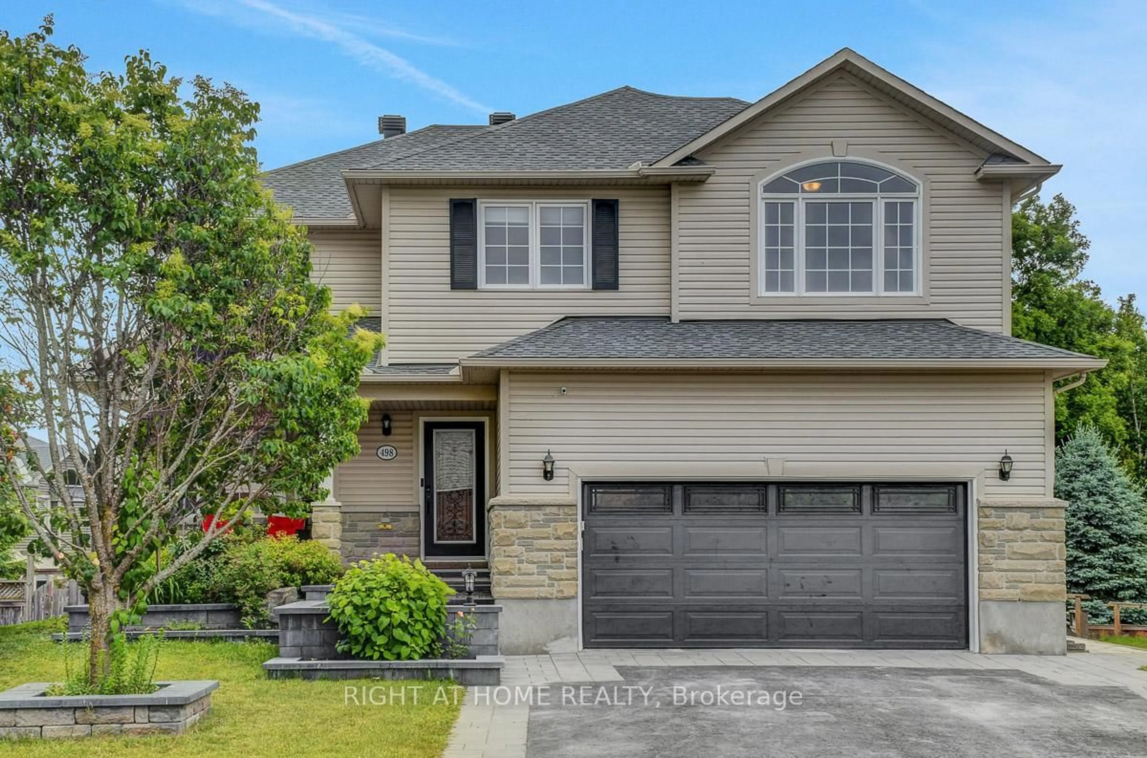 Home with vinyl exterior material, street for 498 Landswood Way, Ottawa Ontario K2S 0A5