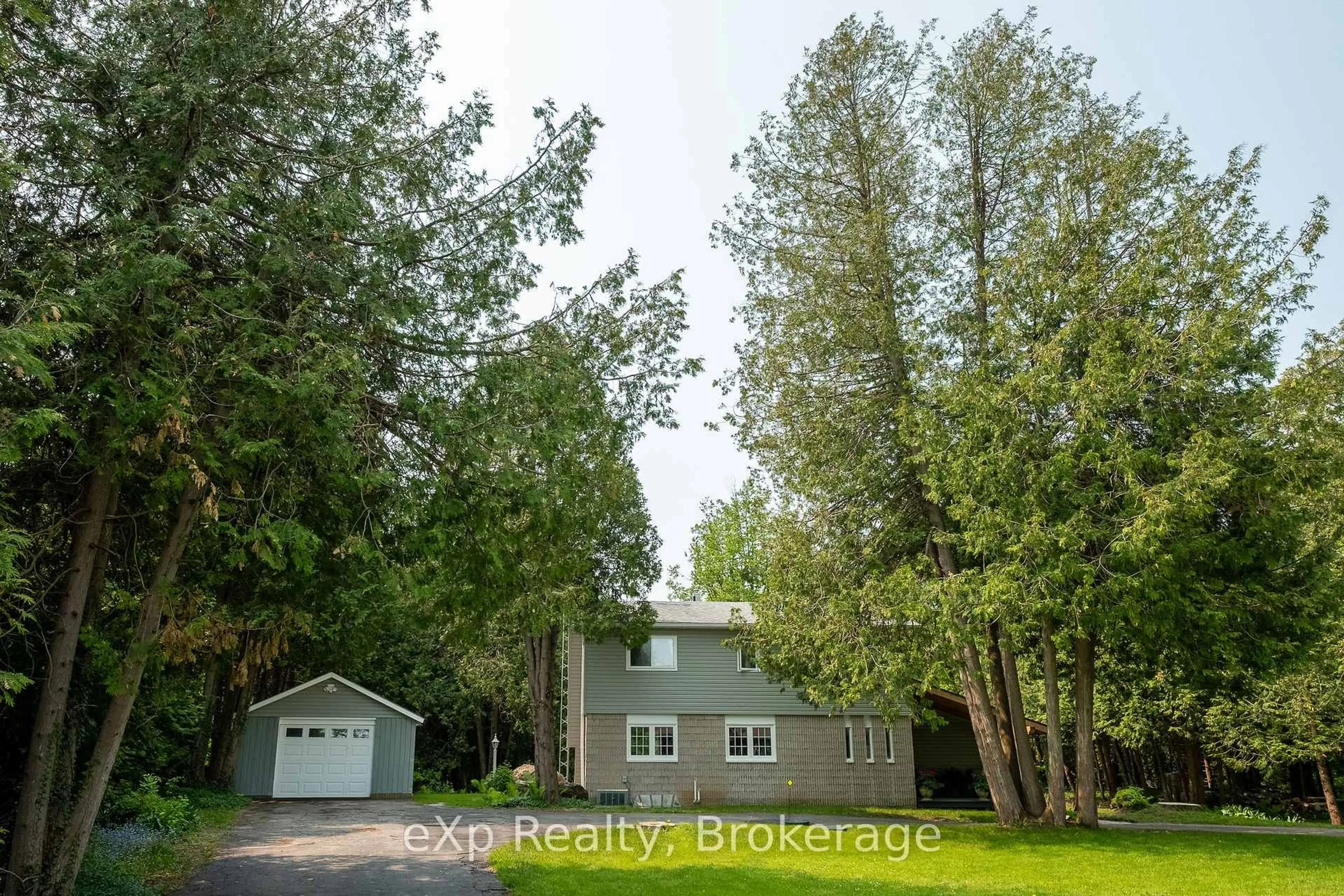 A pic from outside/outdoor area/front of a property/back of a property/a pic from drone, forest/trees view for 19 & 23 Front St, South Bruce Peninsula Ontario N0H 2T0