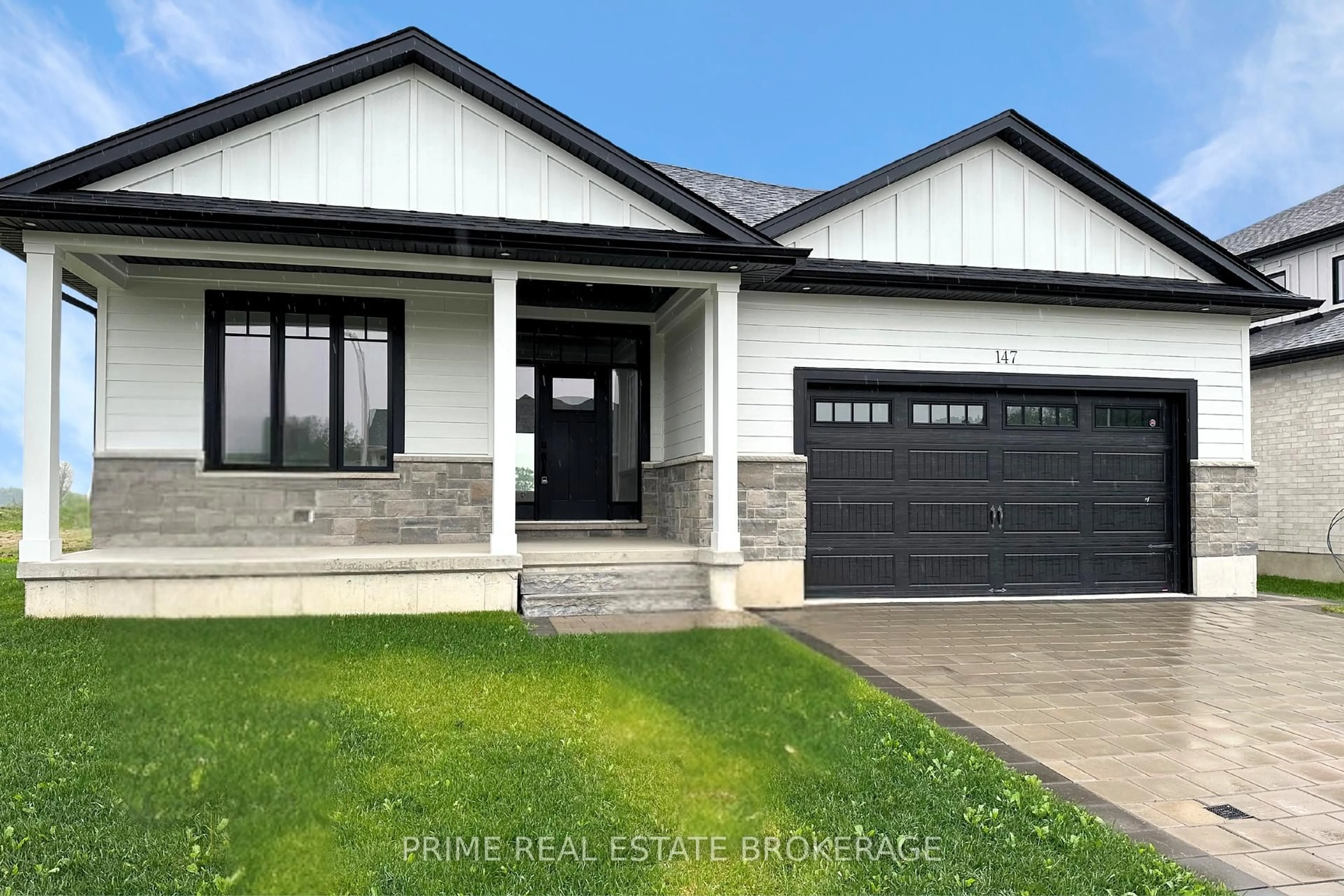 Home with vinyl exterior material, street for 147 McLeod St, North Middlesex Ontario N0M 2K0