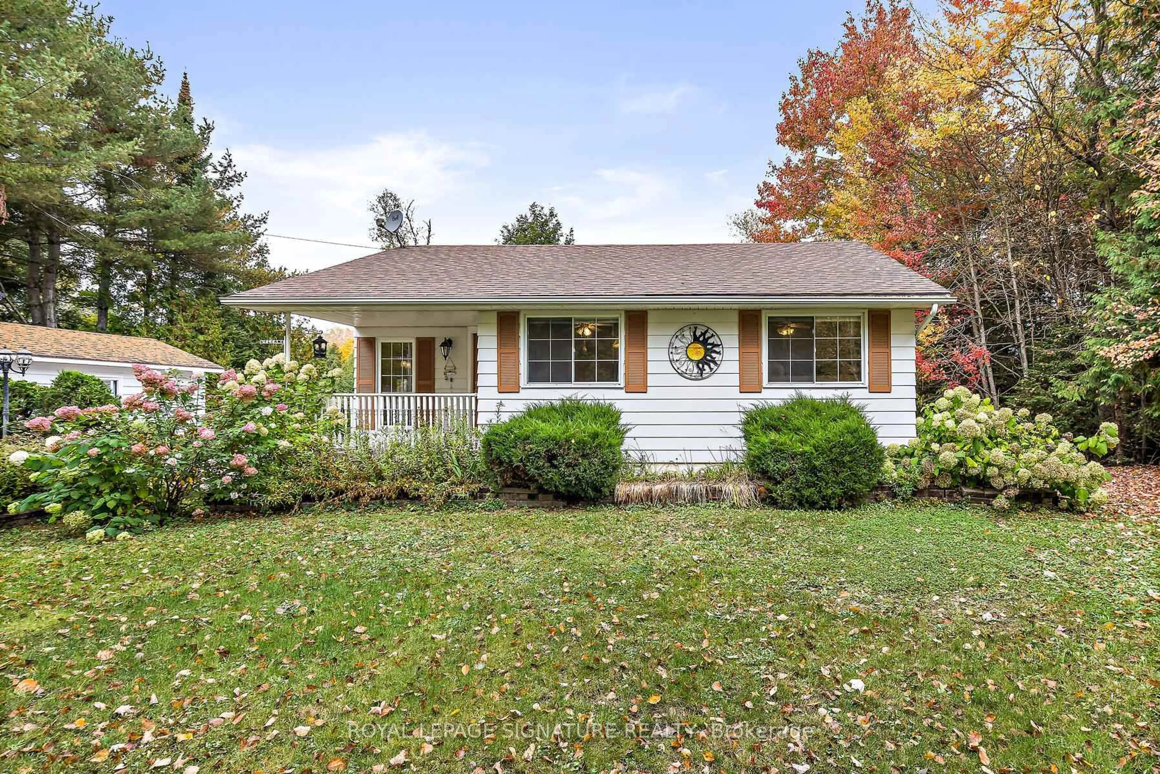 Home with vinyl exterior material, street for 1047 Lagoon Rd, Highlands East Ontario K0L 1C0
