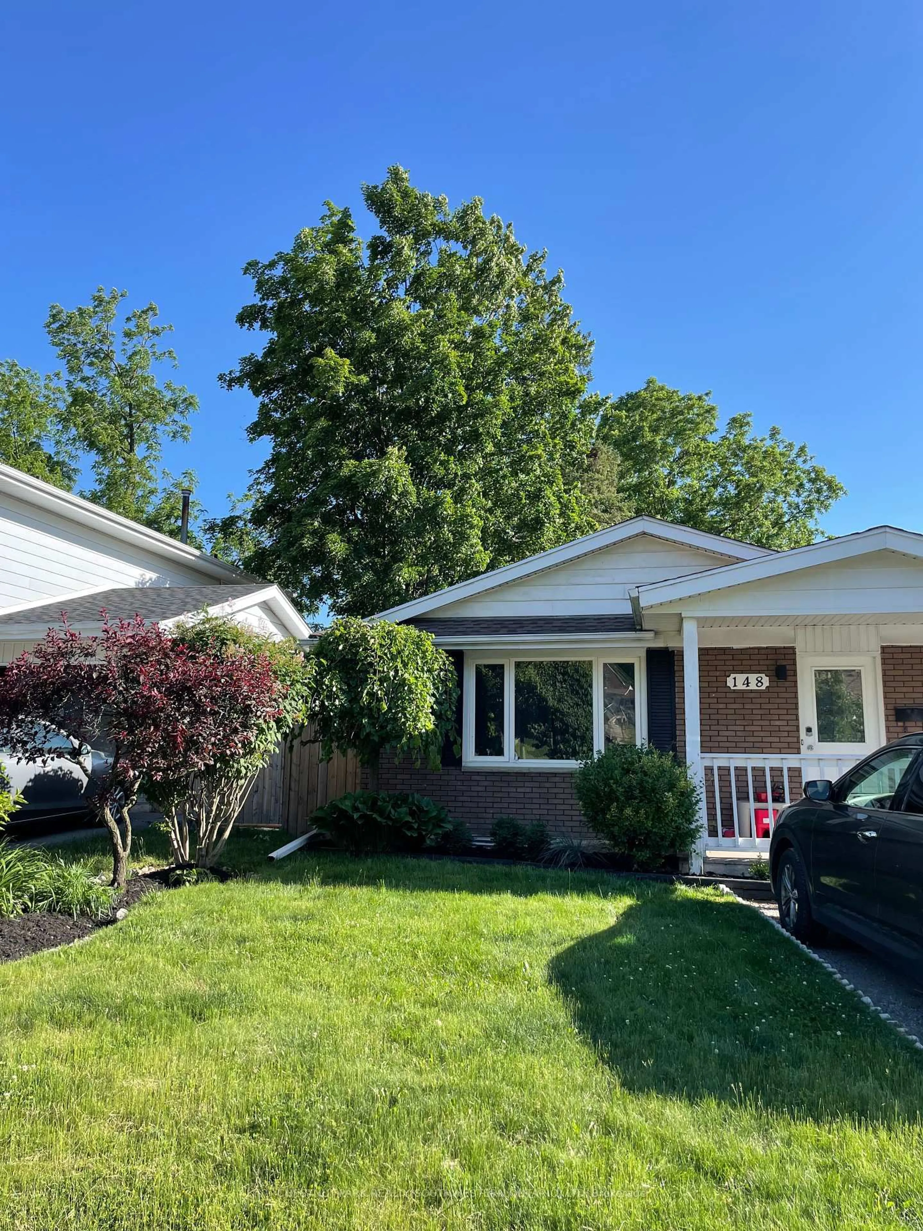 Home with vinyl exterior material, street for 148 Green Valley Dr, Kitchener Ontario N2P 1C4
