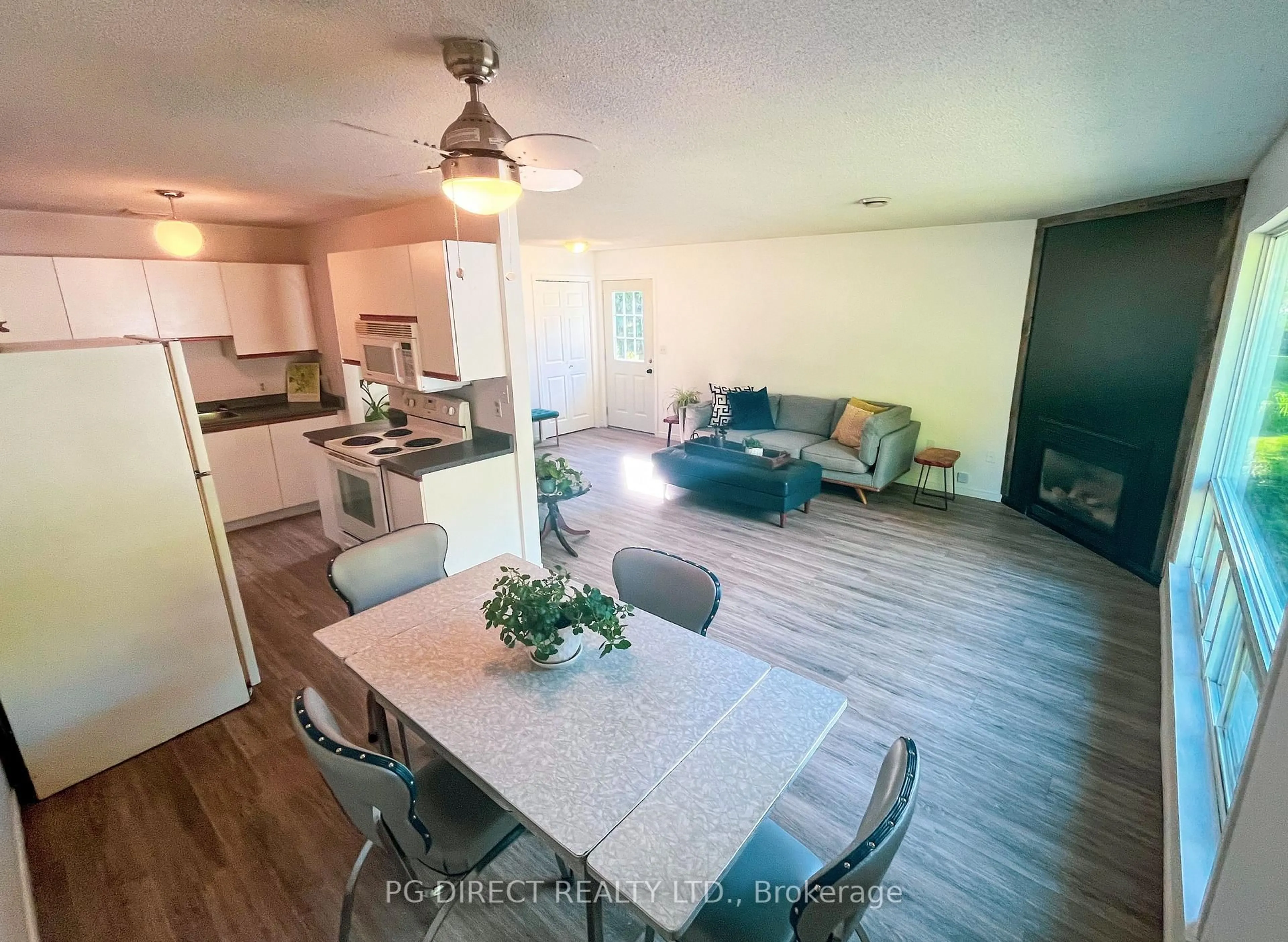 Open concept kitchen, wood/laminate floor for 54 Pinecone Dr, Bracebridge Ontario P1L 2G3