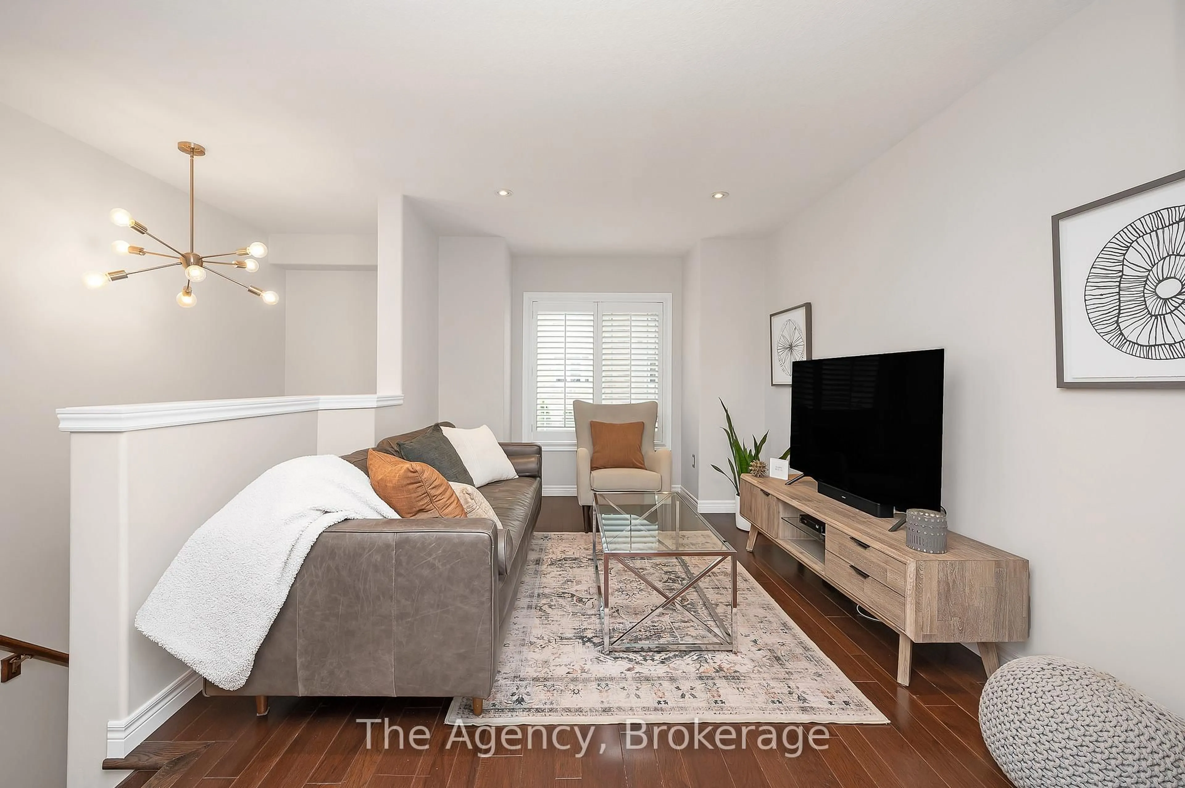 Living room with furniture, wood/laminate floor for 201 Westbank Tr #13, Hamilton Ontario L8J 0H5