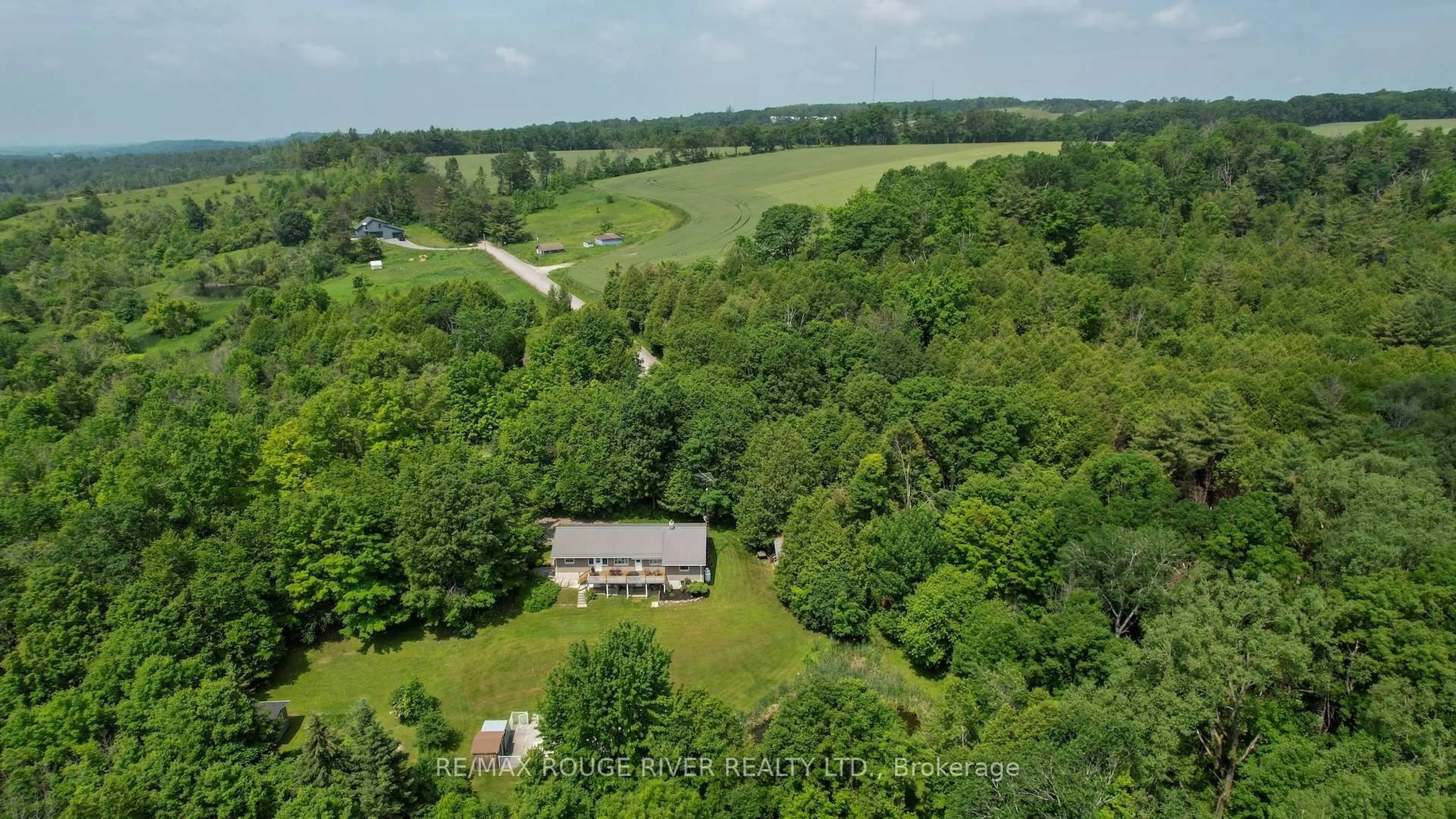 A pic from outside/outdoor area/front of a property/back of a property/a pic from drone, forest/trees view for 363 Earl Rd, Hamilton Township Ontario K0K 2H0