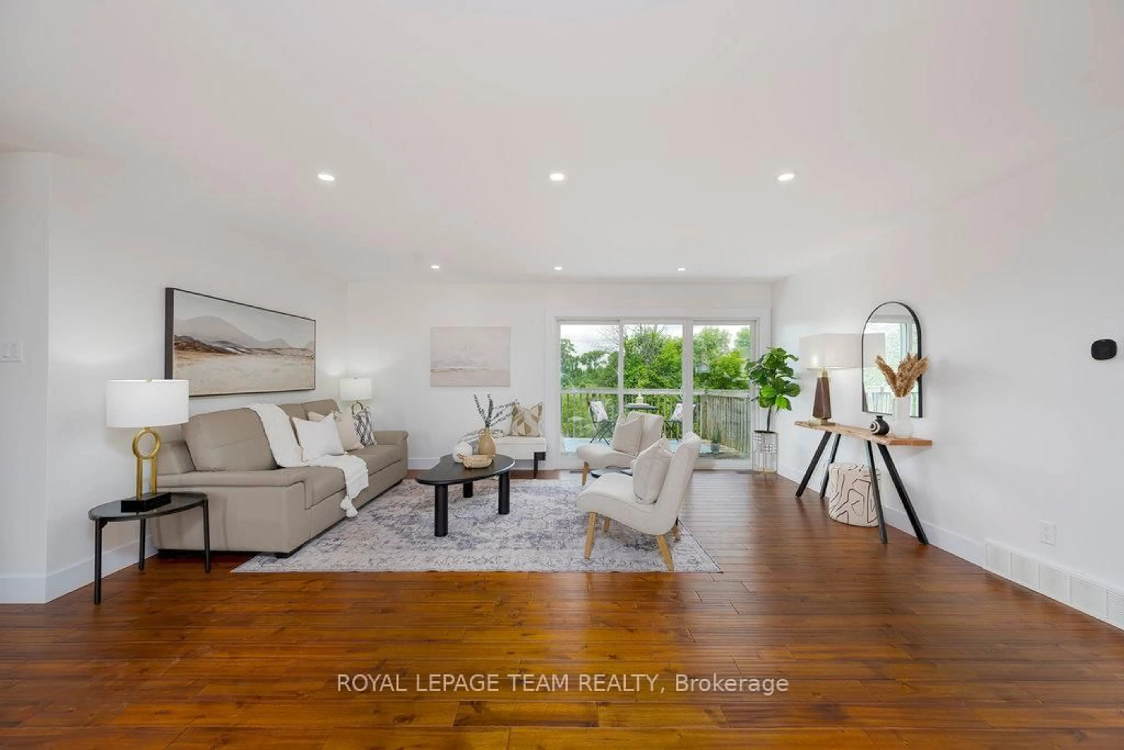 Living room with furniture, wood/laminate floor for 517 Donald B. Munro Dr, Carp Ontario K0A 1L0