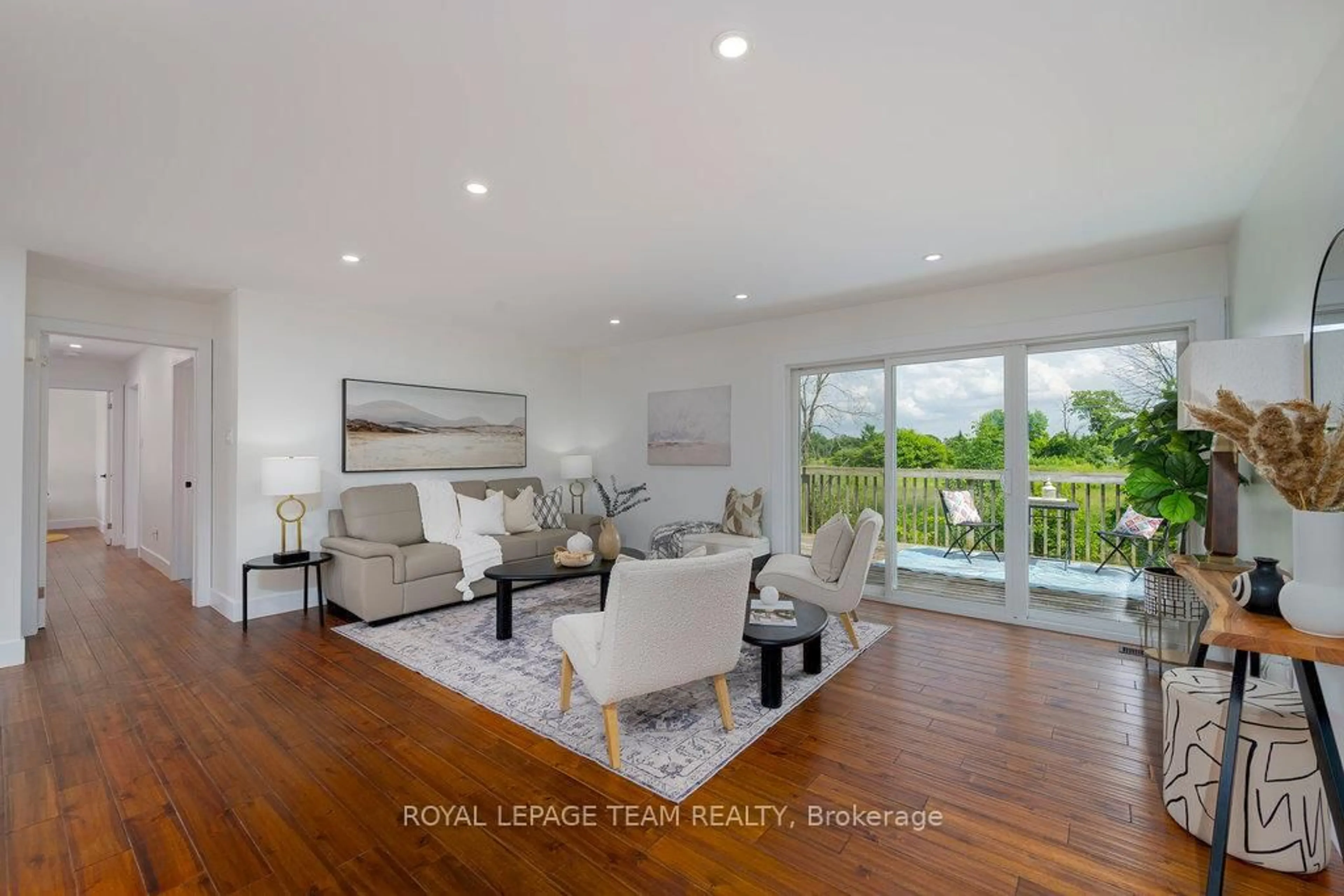 Living room with furniture, wood/laminate floor for 517 Donald B. Munro Dr, Carp Ontario K0A 1L0
