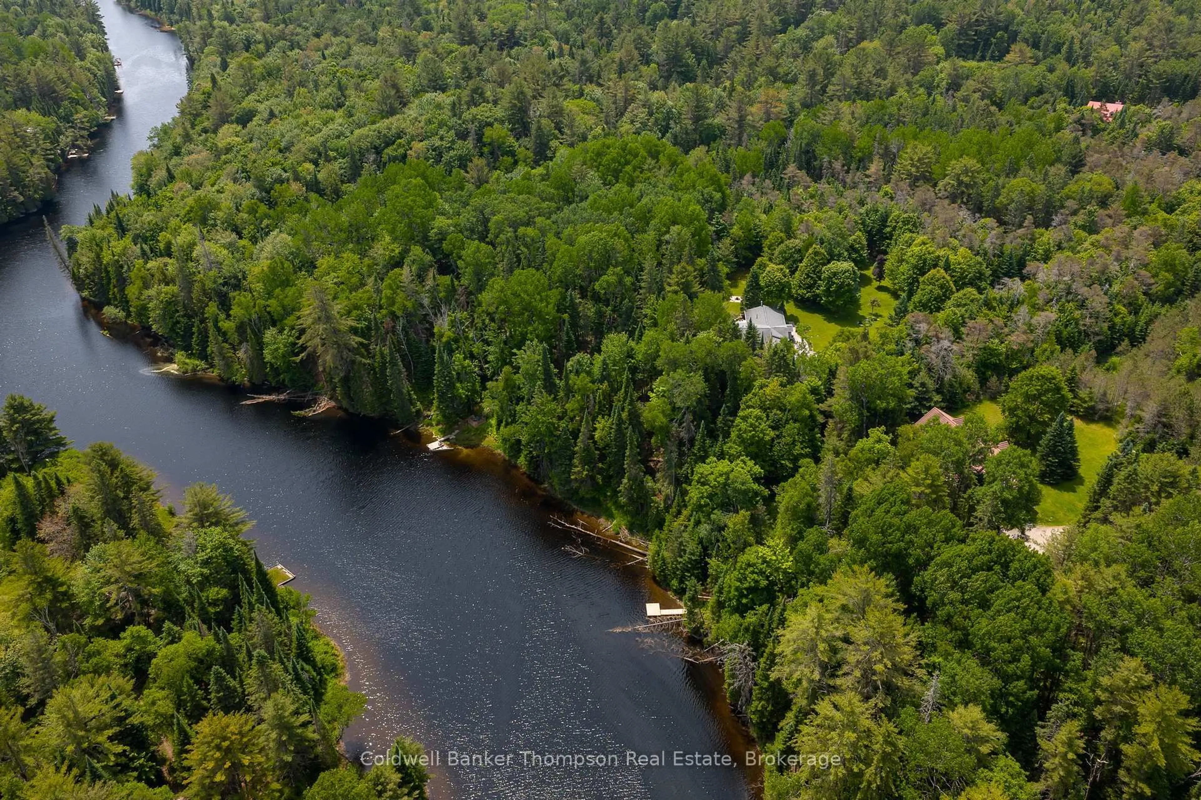 A pic from outside/outdoor area/front of a property/back of a property/a pic from drone, water/lake/river/ocean view for 57 Hiawatha Dr, Huntsville Ontario P0B 1L0