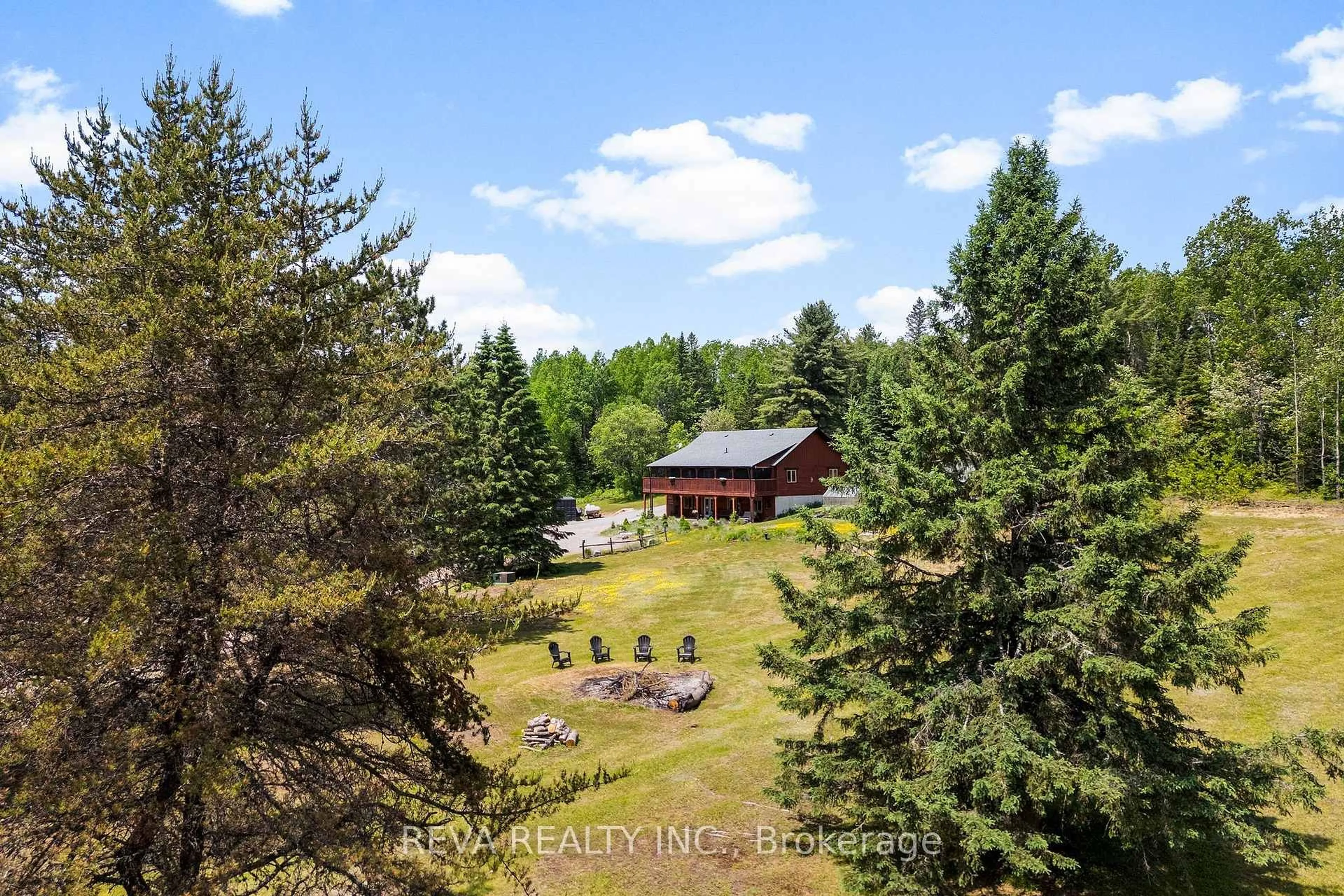 A pic from outside/outdoor area/front of a property/back of a property/a pic from drone, forest/trees view for 902 North Baptiste Lake Rd, Maynooth Ontario K0L 2S0