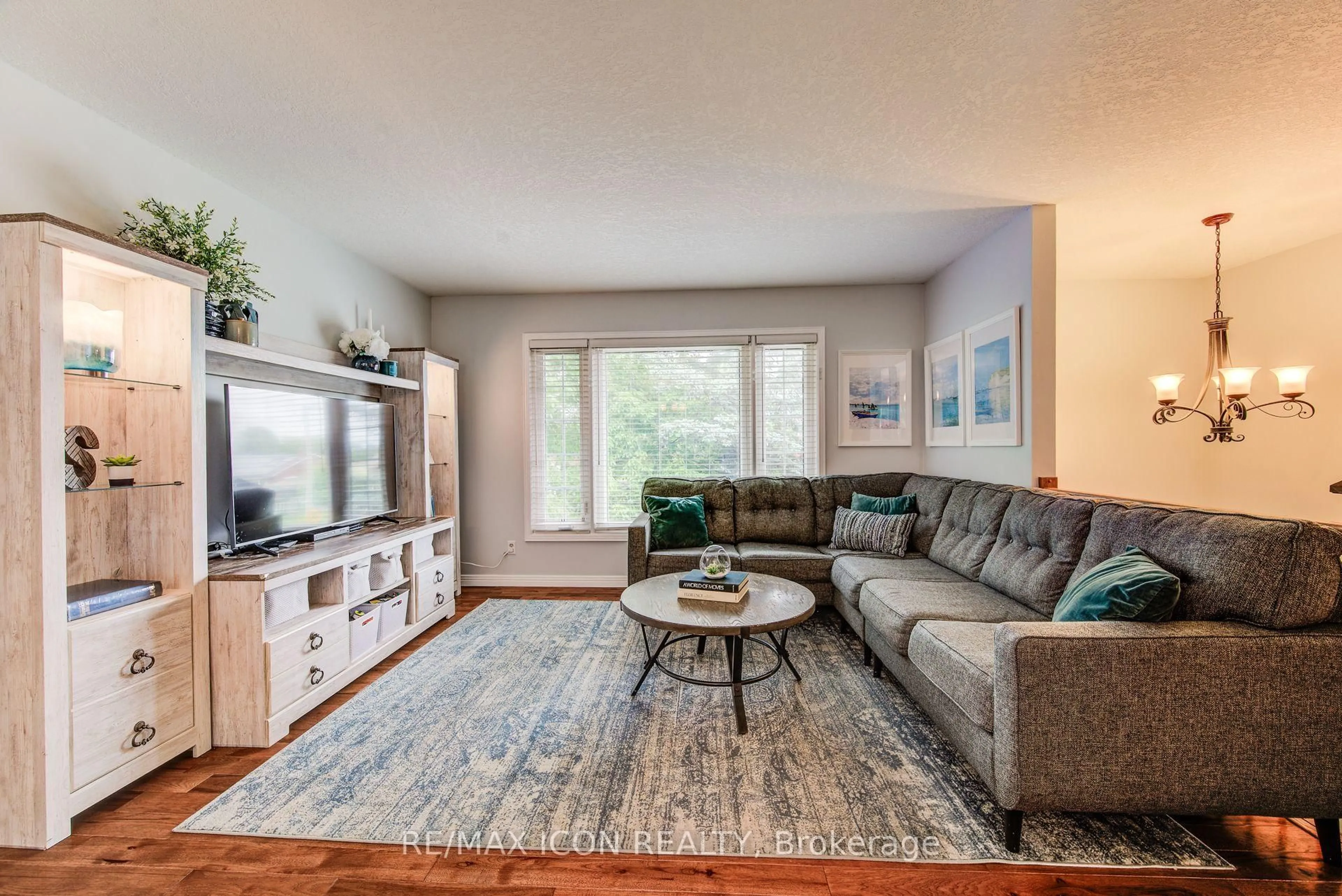 Living room with furniture, wood/laminate floor for 156 MARKSAM Rd, Guelph Ontario N1H 6T6