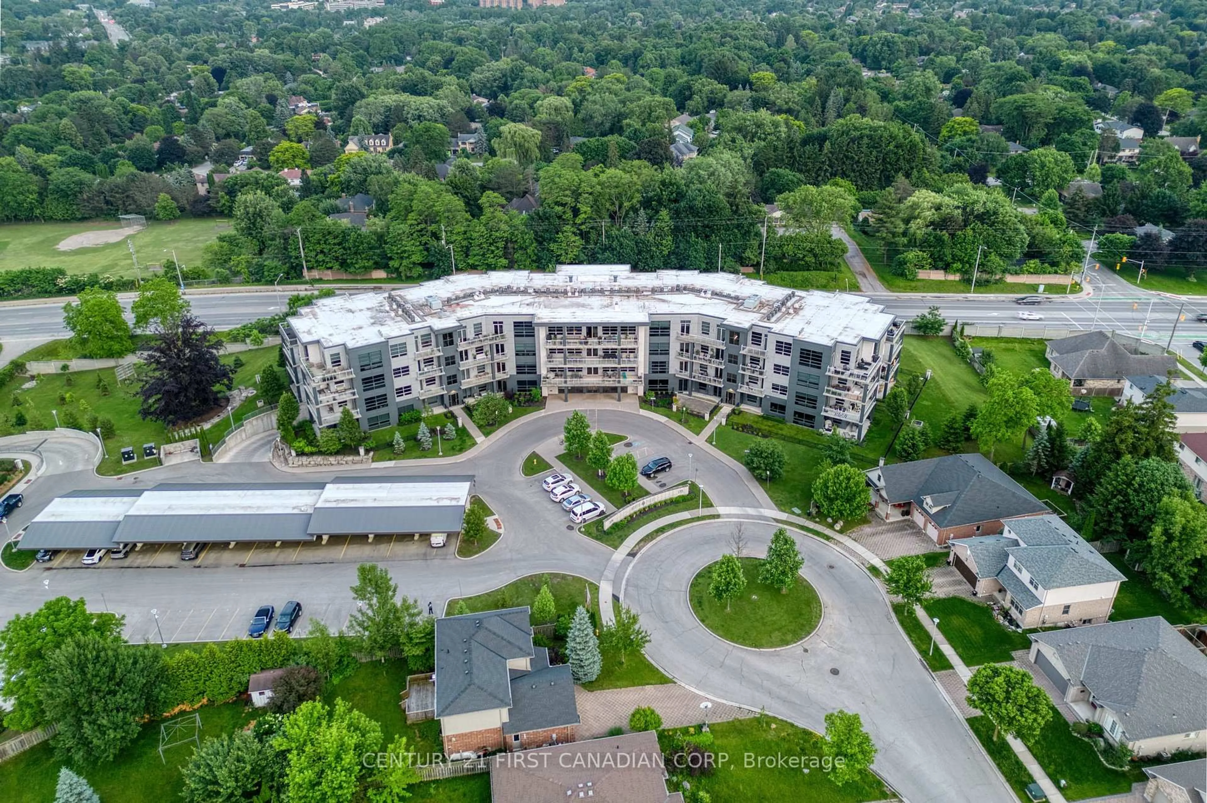 A pic from outside/outdoor area/front of a property/back of a property/a pic from drone, unknown for 1705 Fiddlehead Pl #105, London North Ontario N6G 0S1