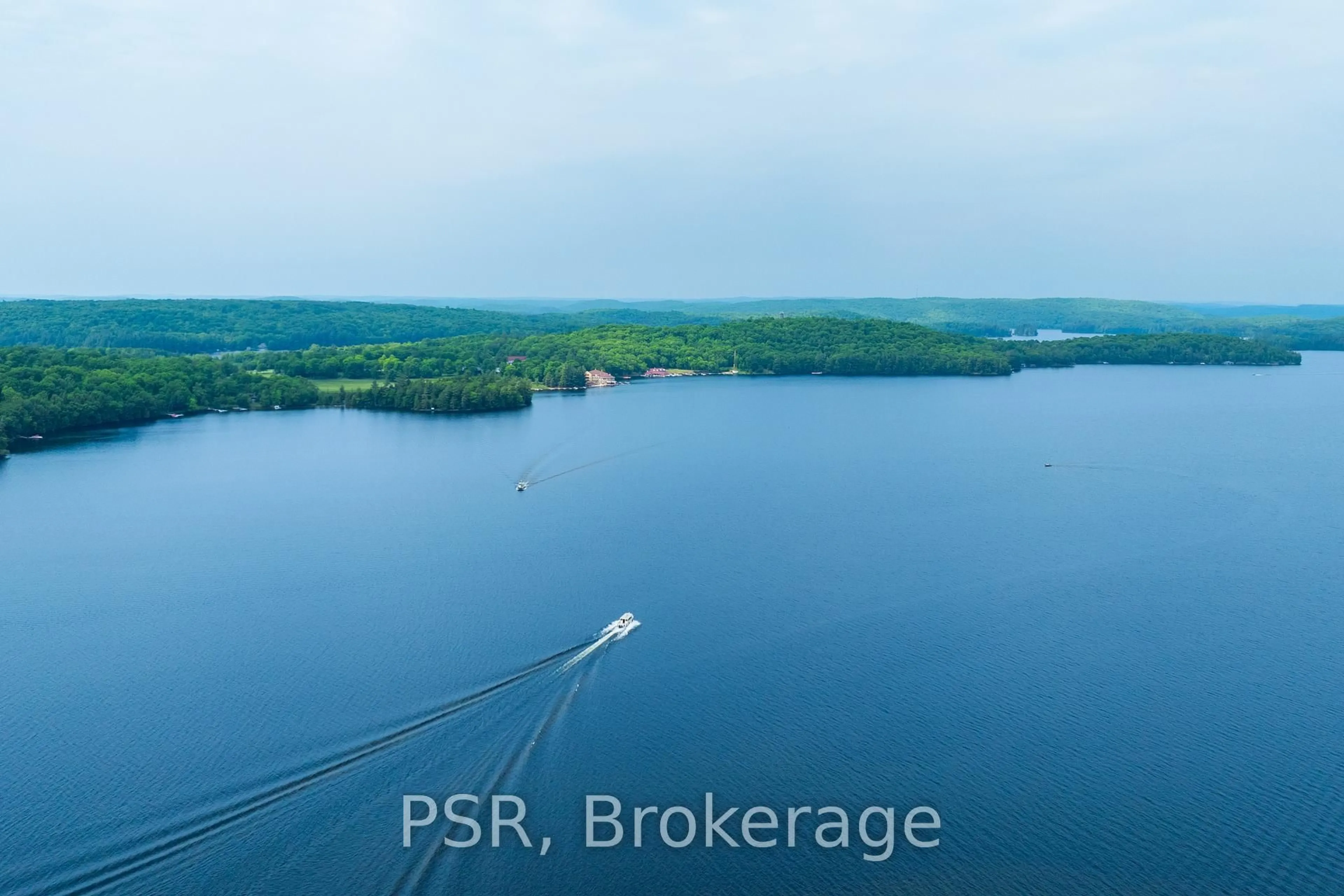 A pic from outside/outdoor area/front of a property/back of a property/a pic from drone, water/lake/river/ocean view for 12 Bigwin Island #318, Lake of Bays Ontario P0B 1A0