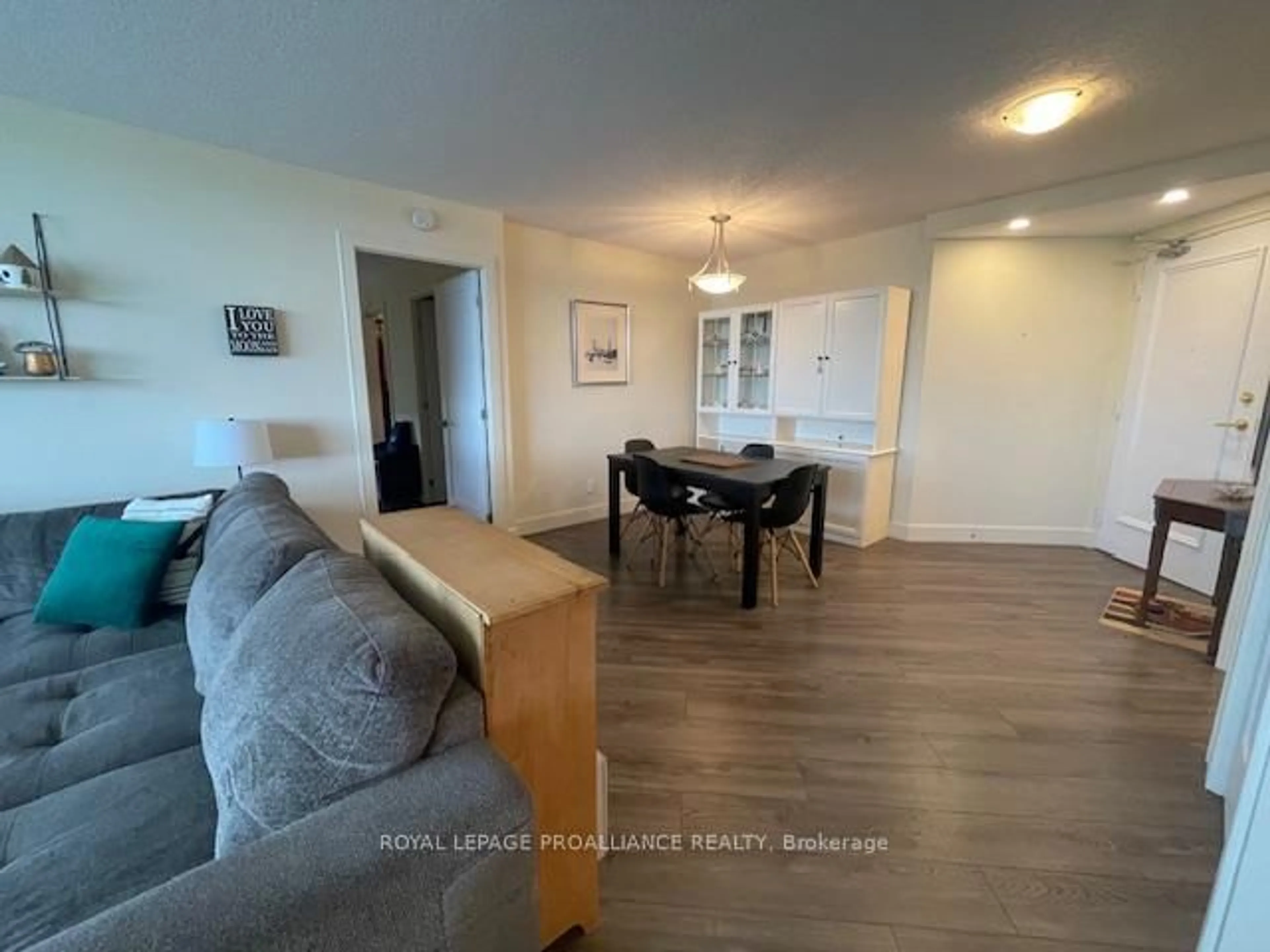 Living room with furniture, wood/laminate floor for 344 Front St #1002, Belleville Ontario K8N 5M4