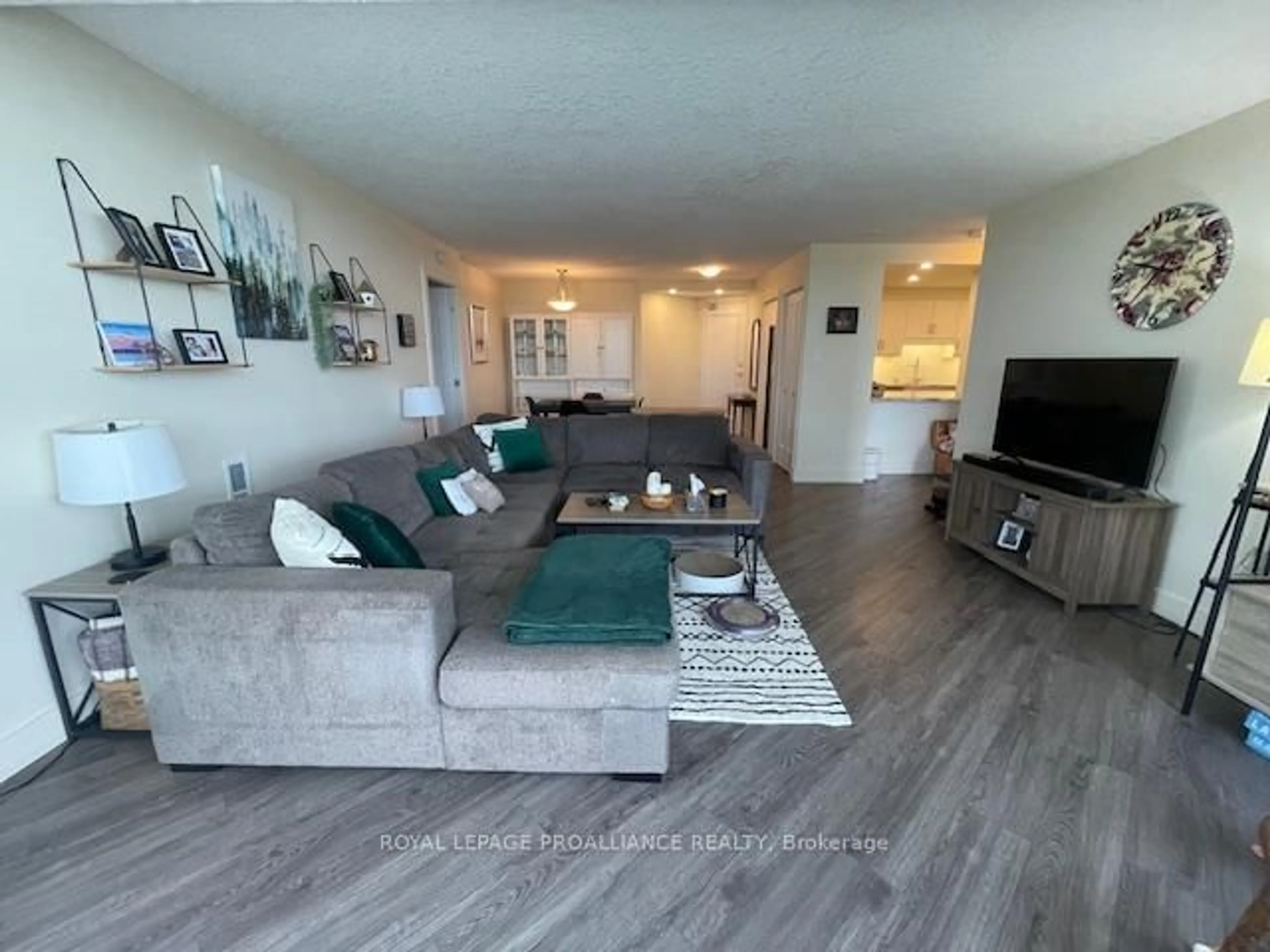 Living room with furniture, wood/laminate floor for 344 Front St #1002, Belleville Ontario K8N 5M4