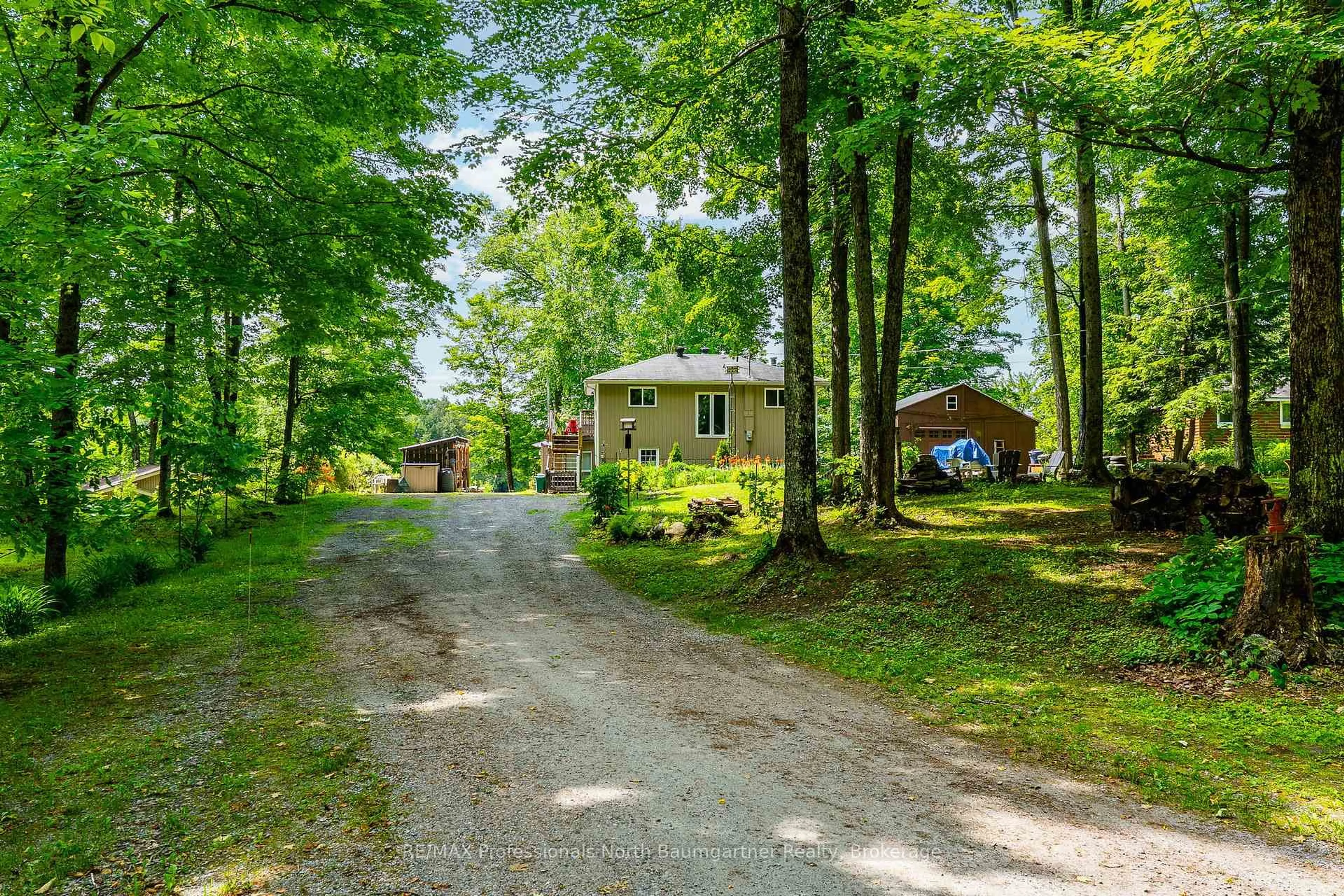A pic from outside/outdoor area/front of a property/back of a property/a pic from drone, street for 1141 Trooper Lake Dr, Highlands East Ontario K0M 1R0