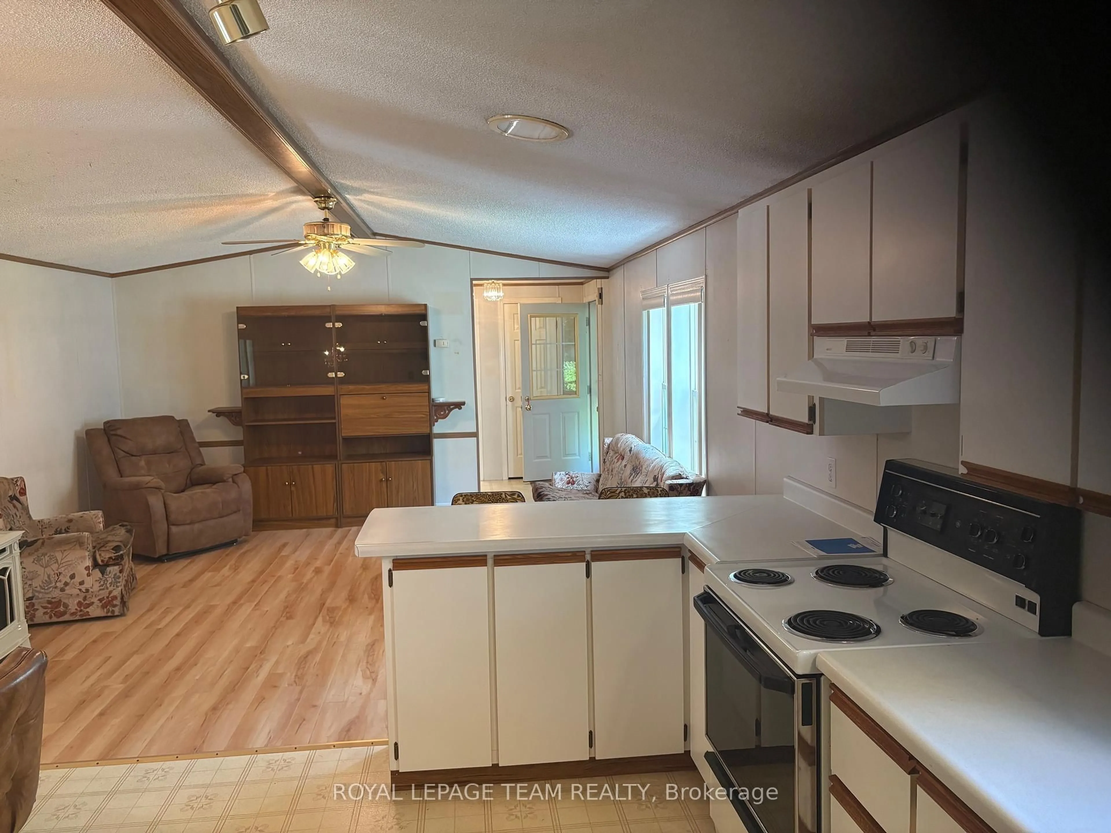 Open concept kitchen, wood/laminate floor for 10146 County 43 Rd #11, North Dundas Ontario K0E 1S0