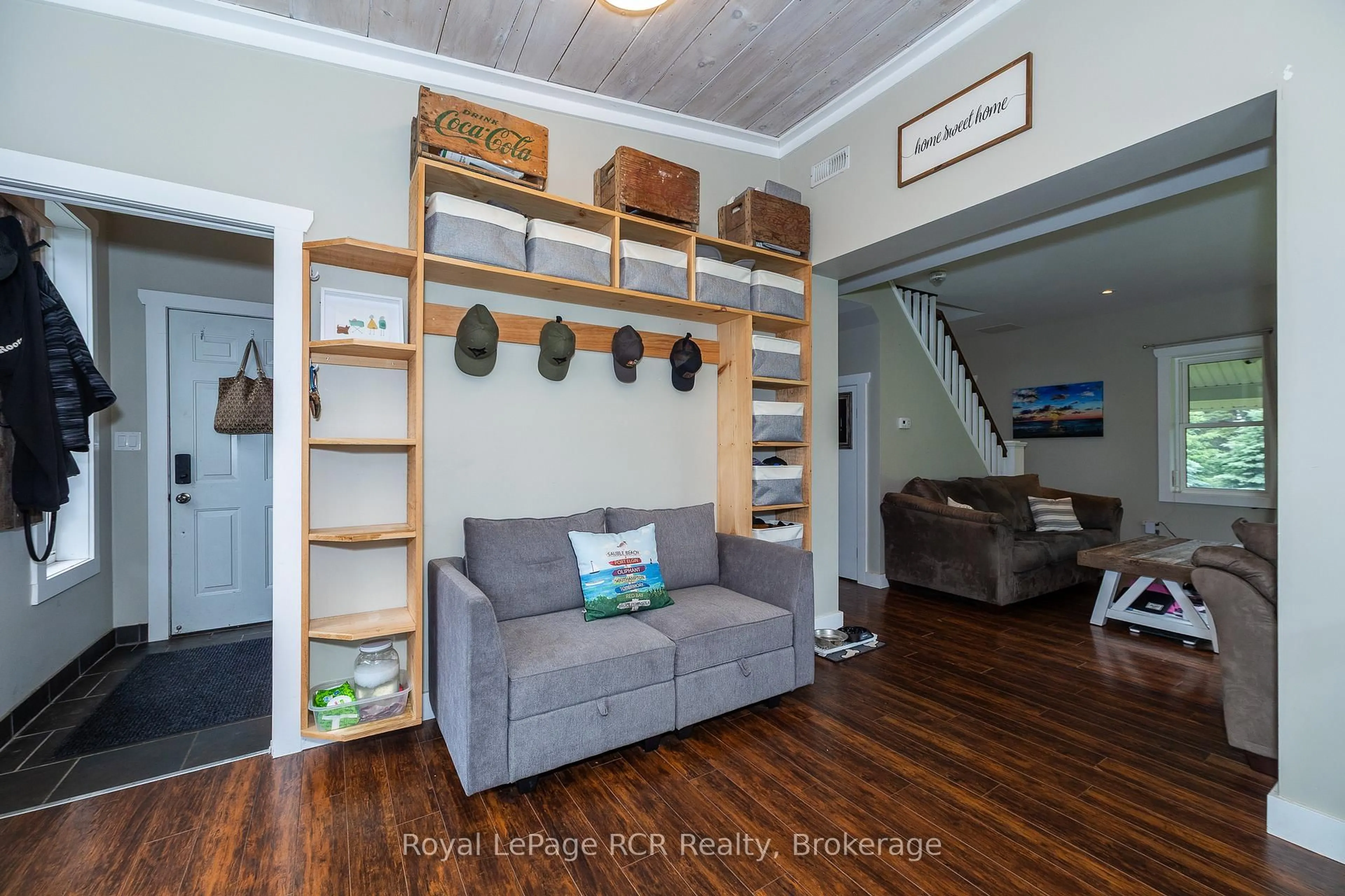 Living room with furniture, wood/laminate floor for 773760 Highway 10, Grey Highlands Ontario N0C 1L0