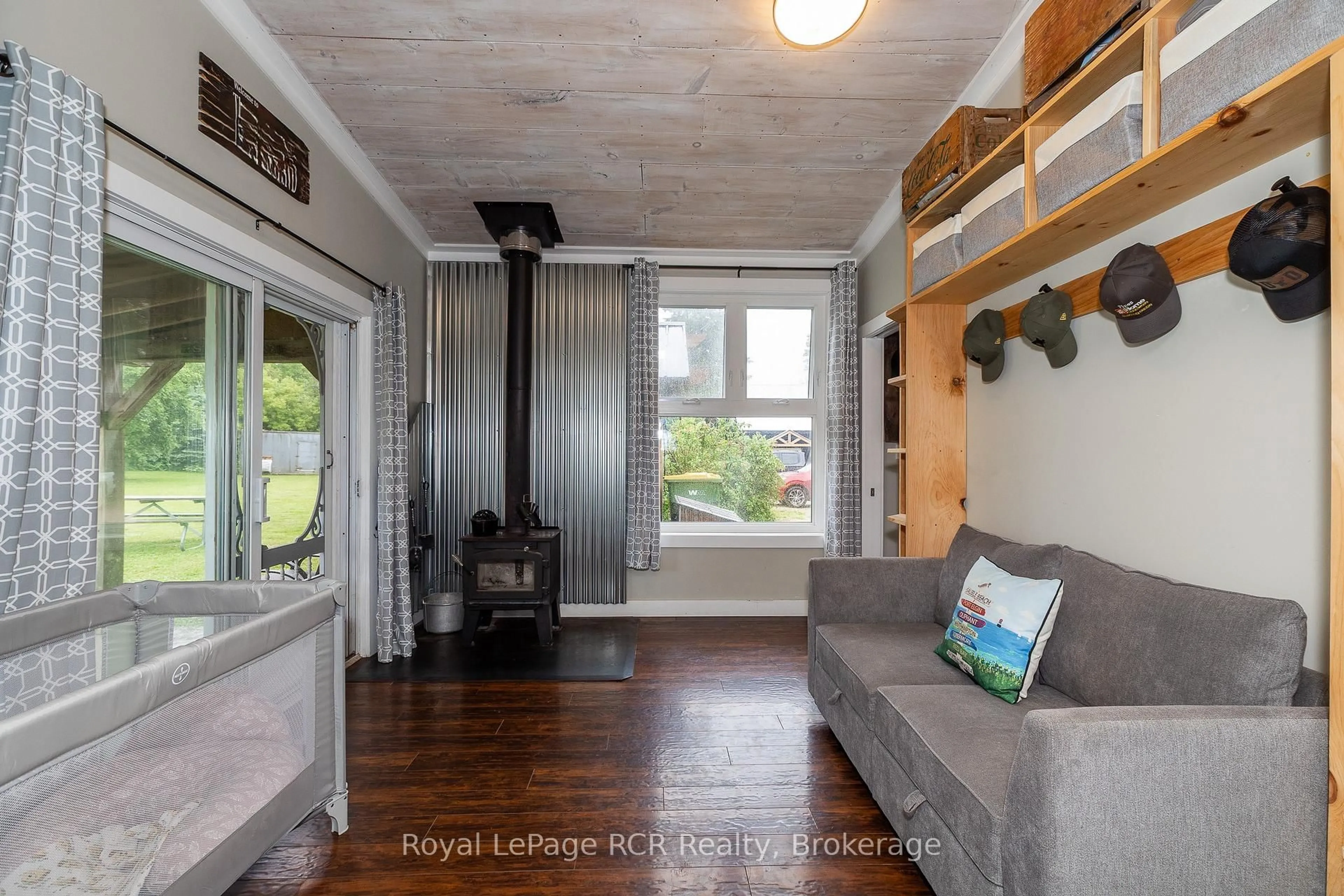 Living room with furniture, wood/laminate floor for 773760 Highway 10, Grey Highlands Ontario N0C 1L0