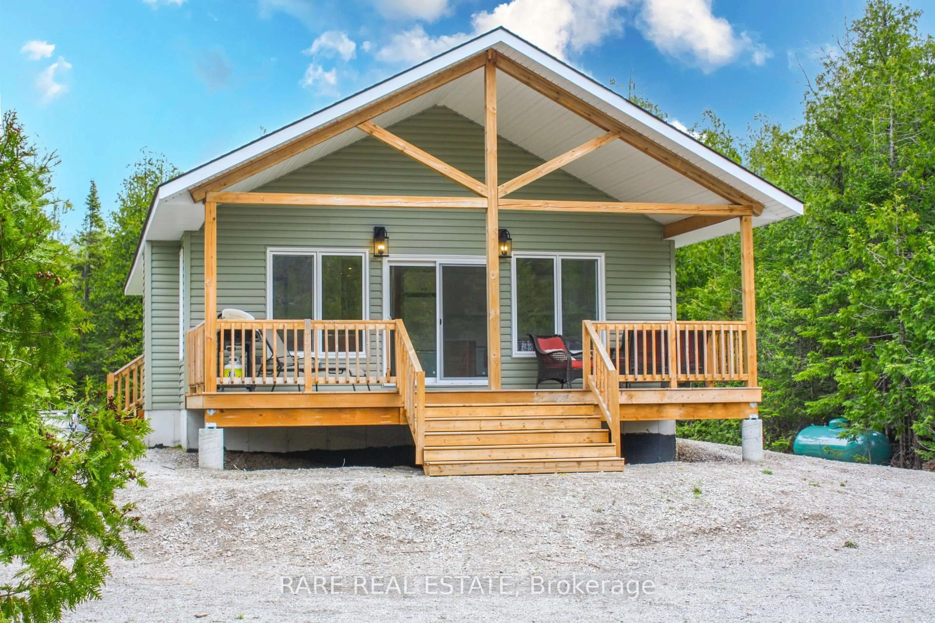 Home with vinyl exterior material, street for 6 Pike St, Northern Bruce Peninsula Ontario N0H 1W0