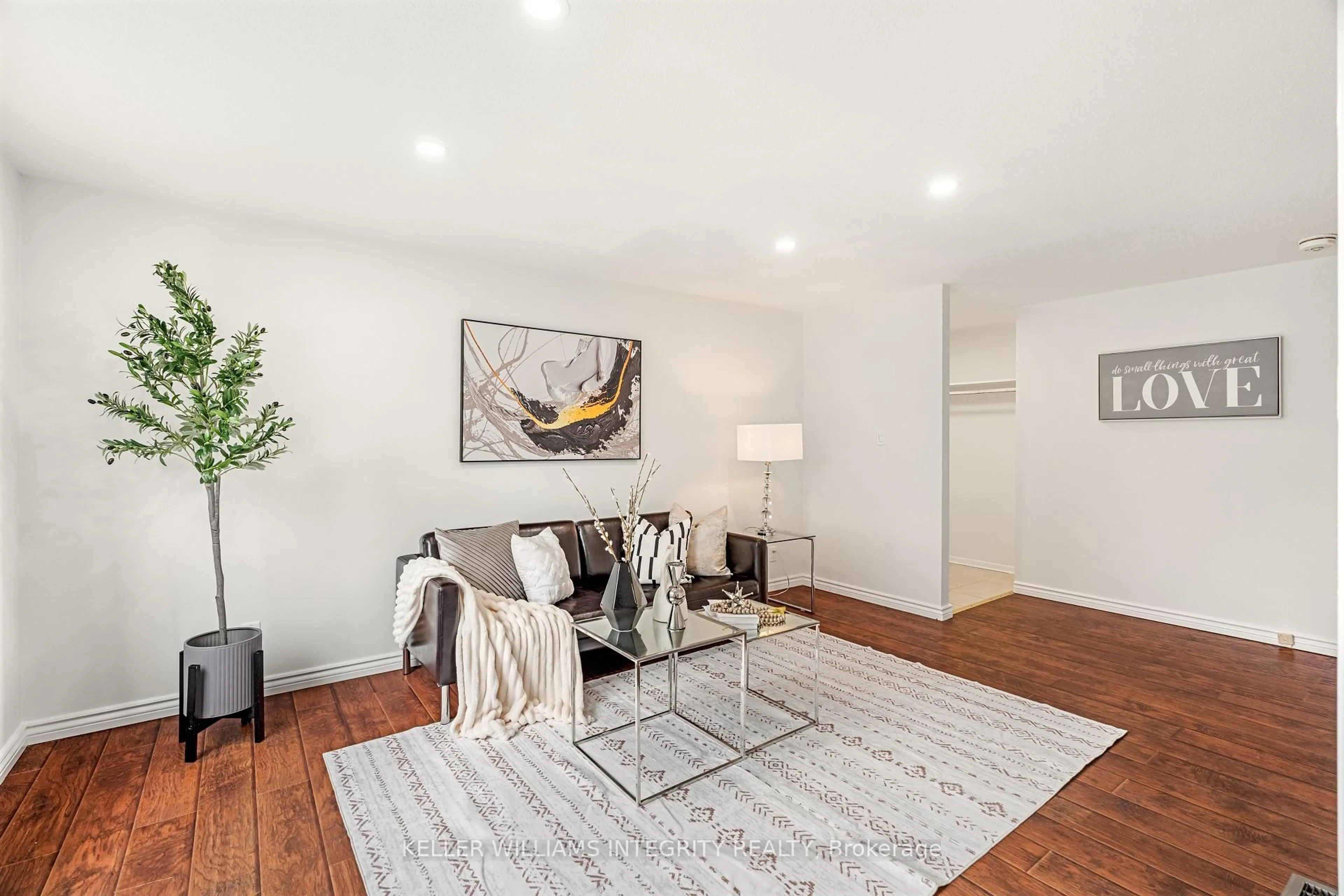 Living room with furniture, wood/laminate floor for 2451 Southvale Cres, Ottawa Ontario K1B 4H6
