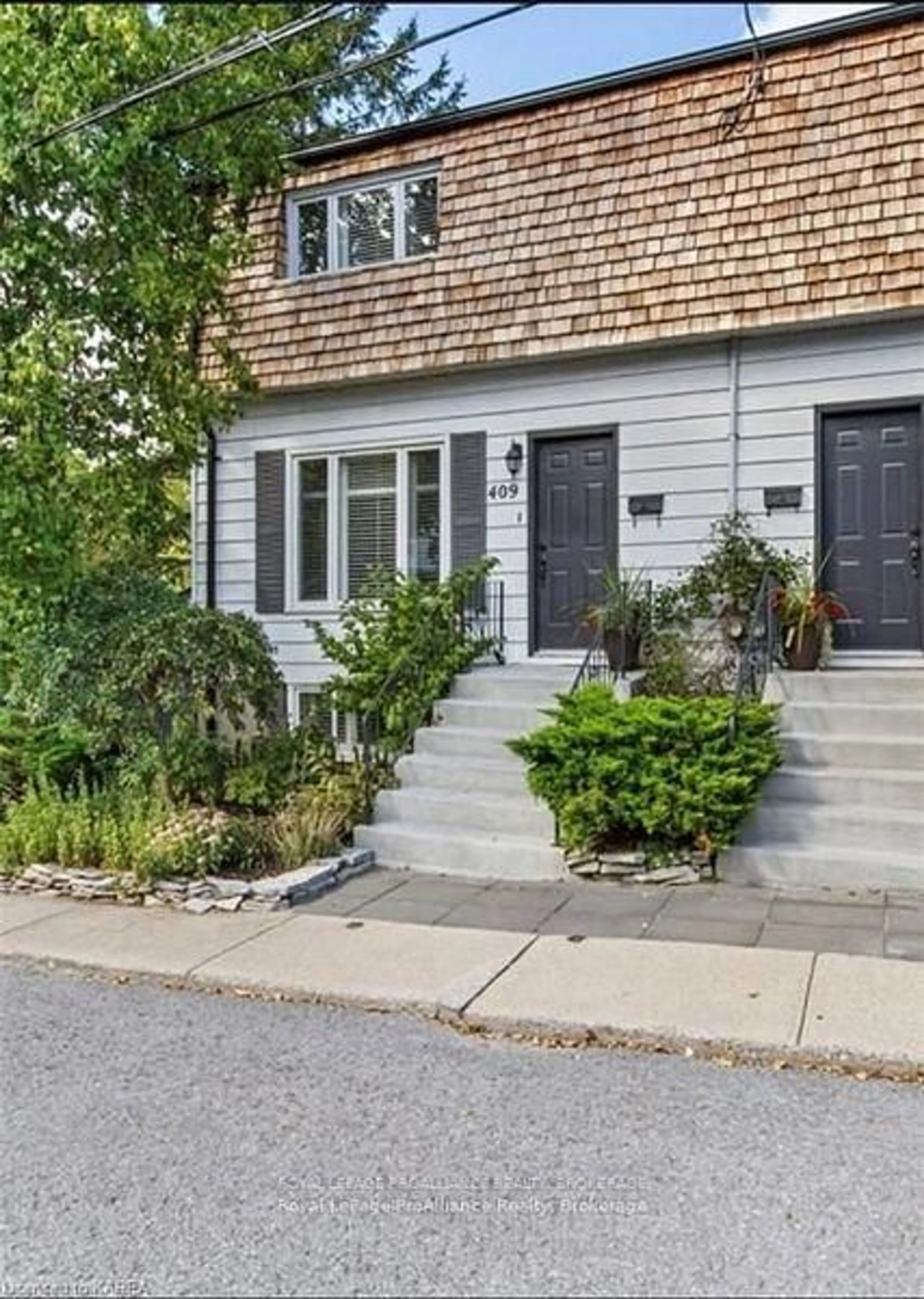 Home with brick exterior material, street for 409 Regent St, Kingston Ontario K7K 5P8