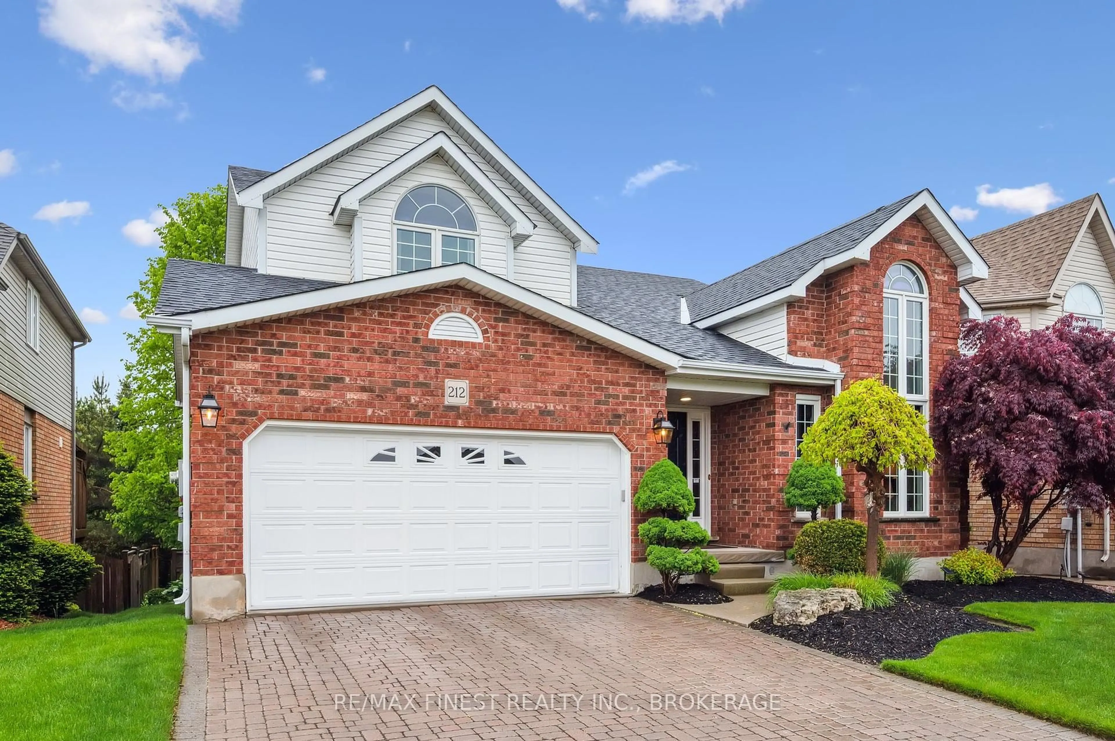 Home with brick exterior material, street for 212 Summerfield Dr, Guelph Ontario N1L 1L3