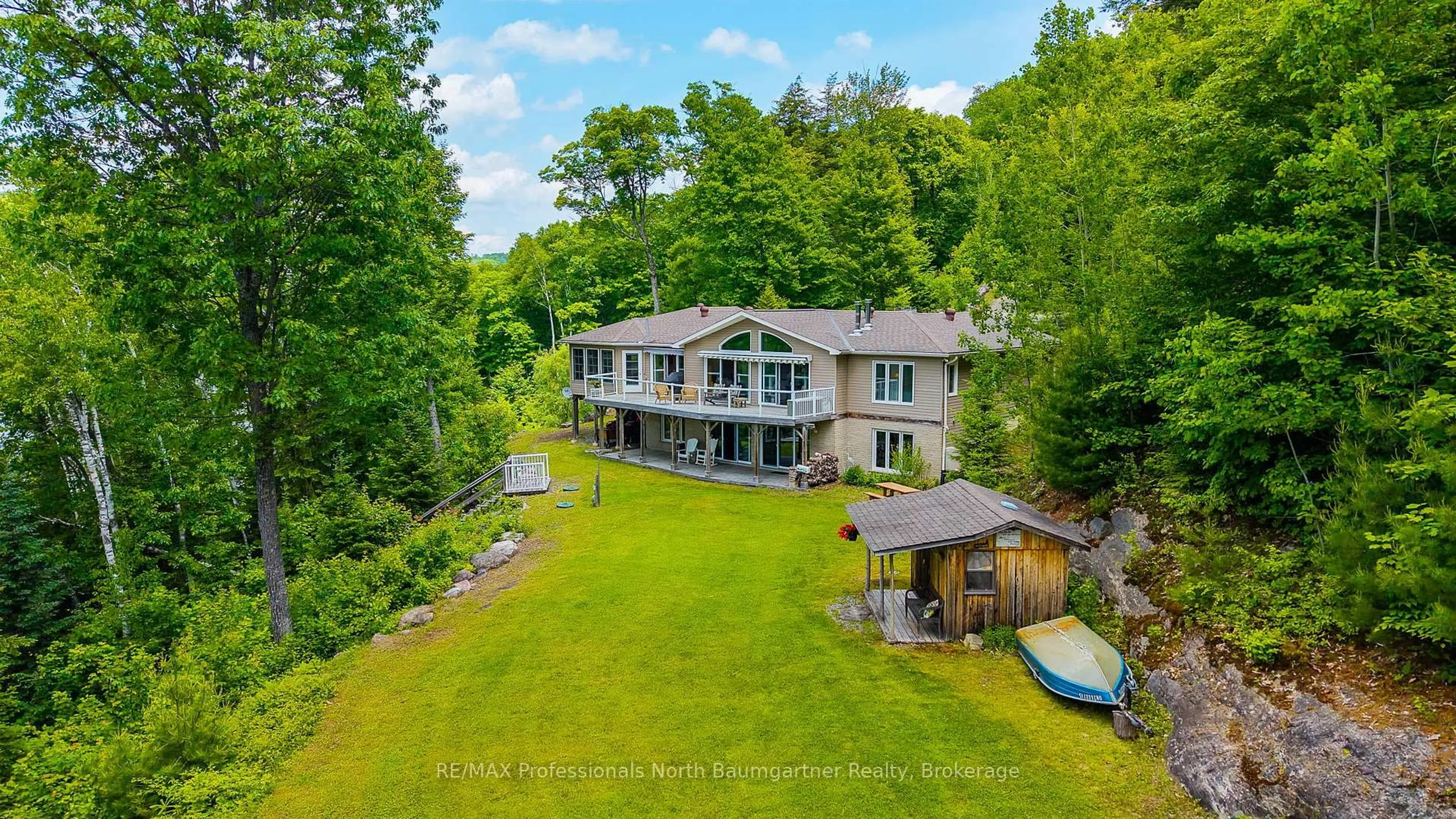 A pic from outside/outdoor area/front of a property/back of a property/a pic from drone, water/lake/river/ocean view for 1132 Trapline Tr, Dysart et al Ontario K0M 1S0