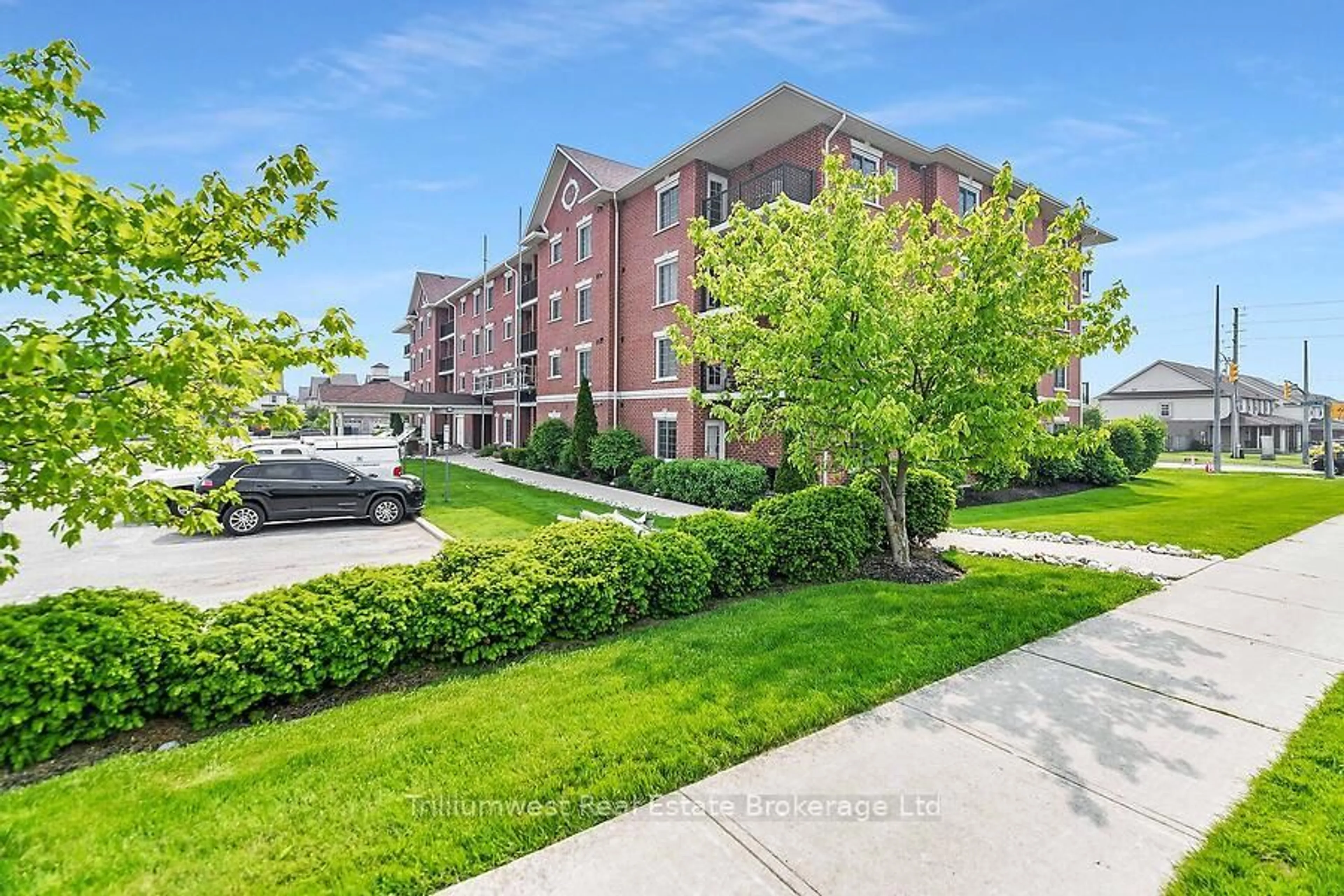 A pic from outside/outdoor area/front of a property/back of a property/a pic from drone, unknown for 415 Grange Rd #310, Guelph Ontario N1E 0C4