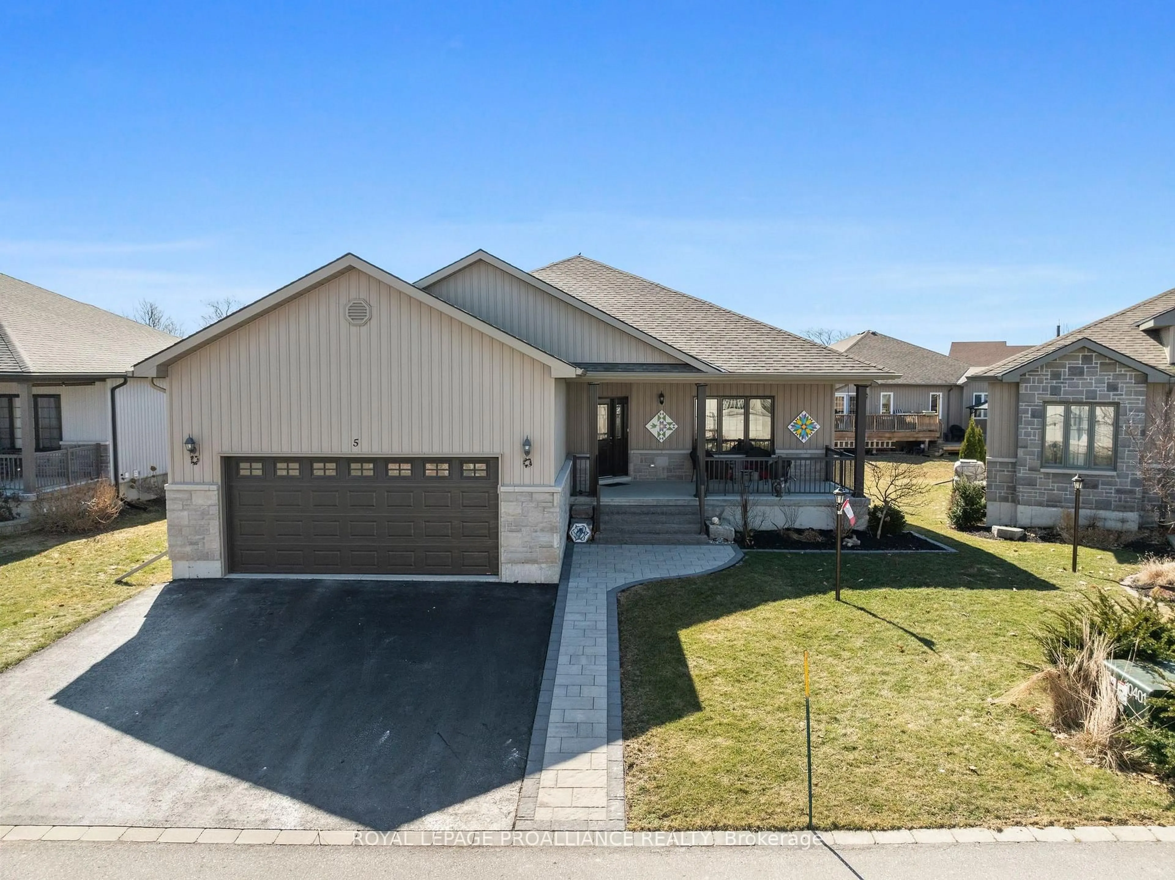 Home with vinyl exterior material, street for 5 Conger Dr, Prince Edward County Ontario K0K 3L0