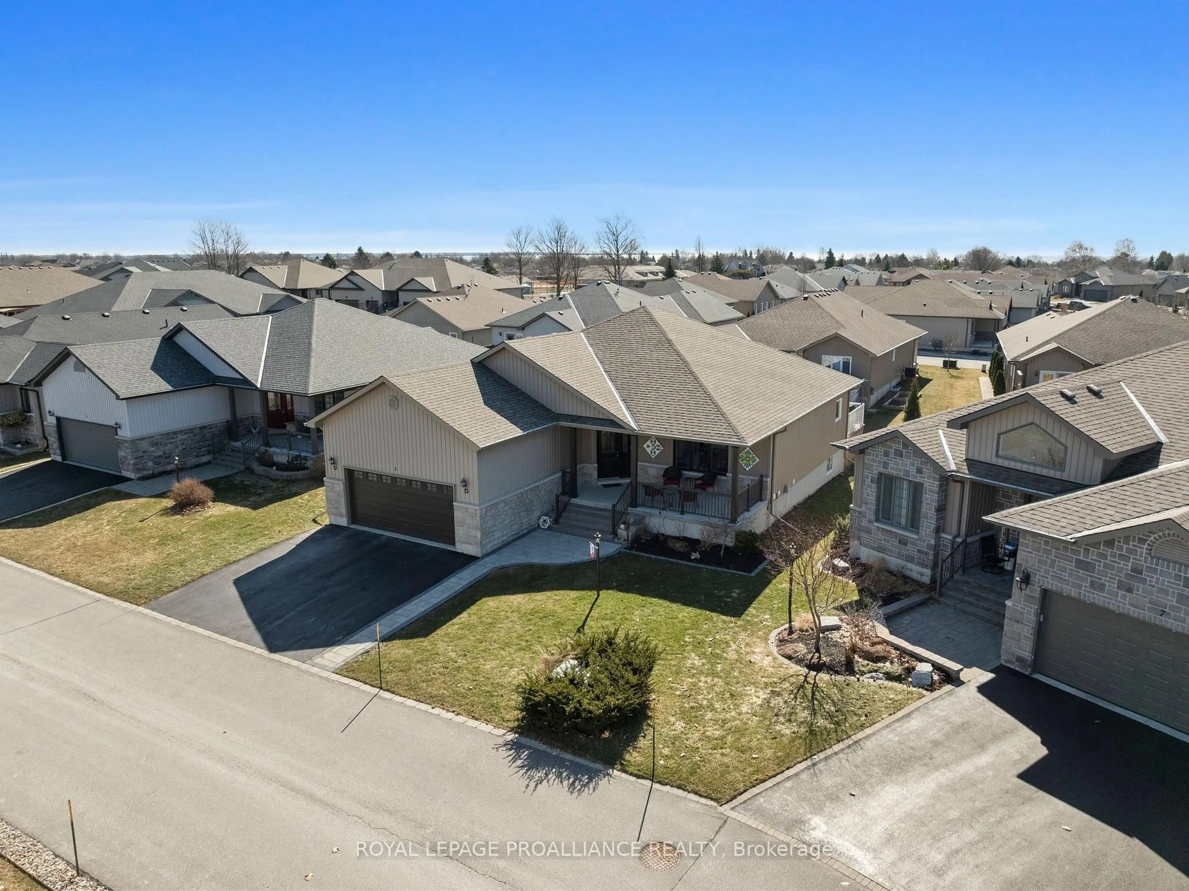 A pic from outside/outdoor area/front of a property/back of a property/a pic from drone, street for 5 Conger Dr, Prince Edward County Ontario K0K 3L0