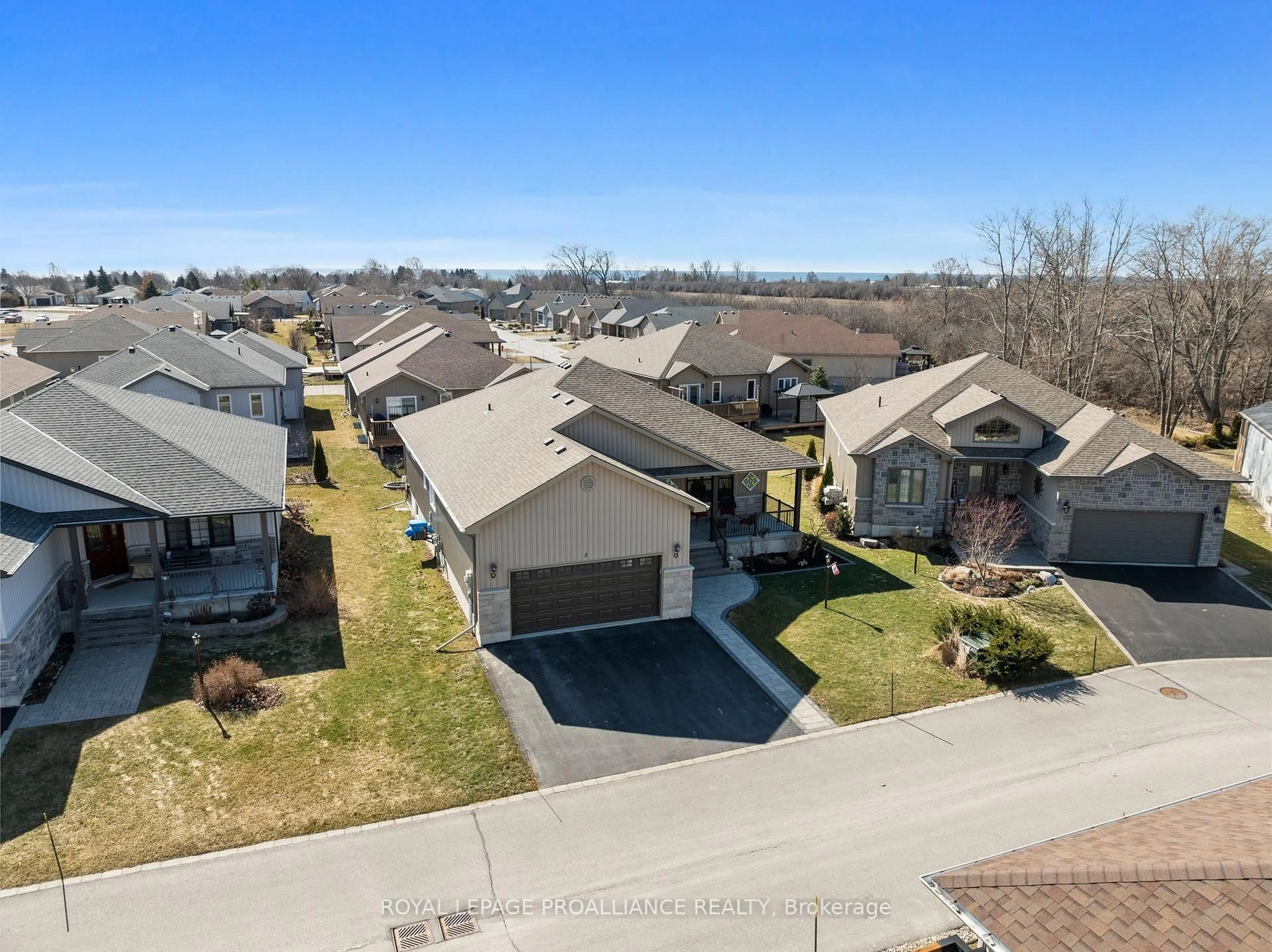 A pic from outside/outdoor area/front of a property/back of a property/a pic from drone, street for 5 Conger Dr, Prince Edward County Ontario K0K 3L0