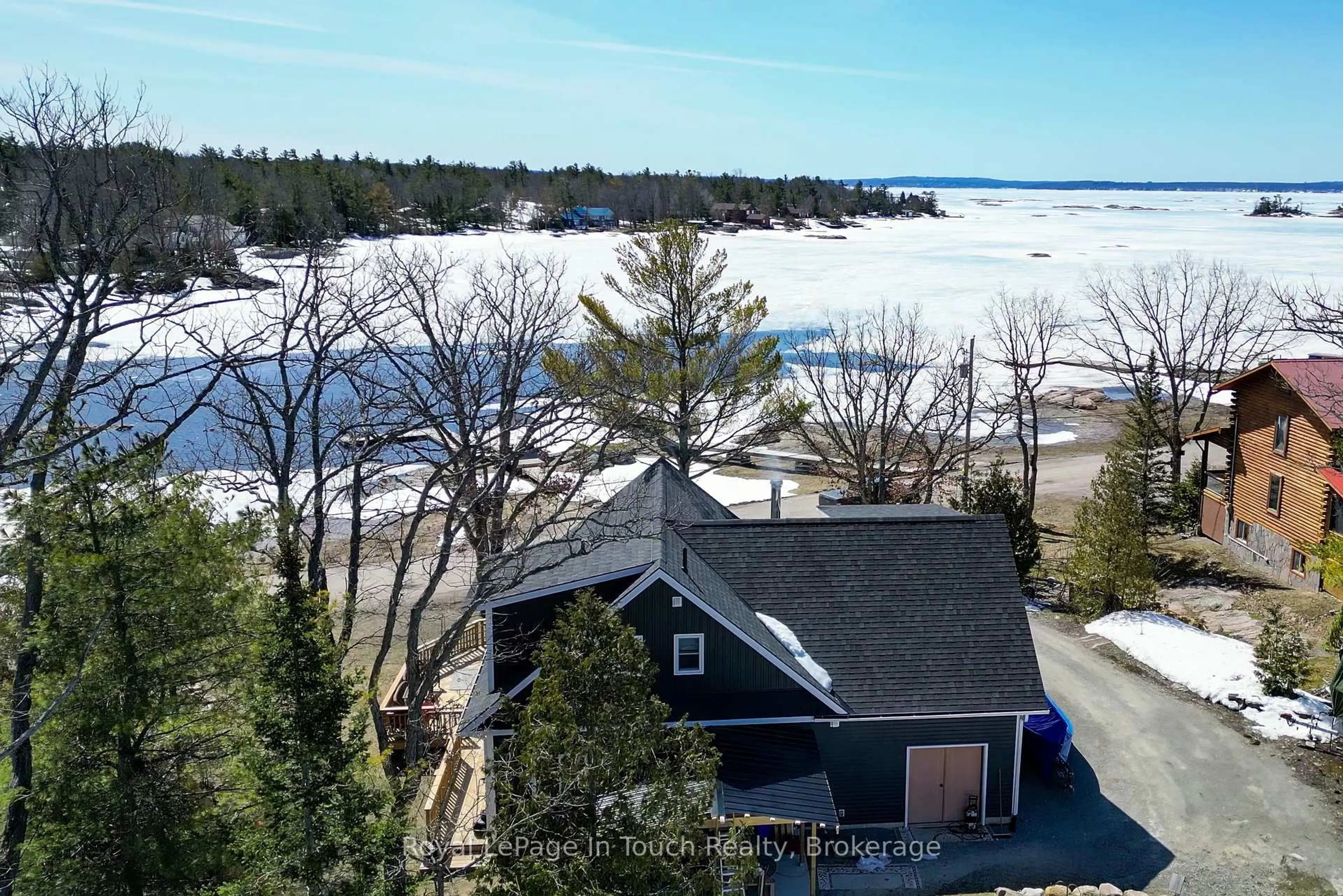 A pic from outside/outdoor area/front of a property/back of a property/a pic from drone, water/lake/river/ocean view for 26 Macey Bay Rd, Georgian Bay Ontario L0K 1S0