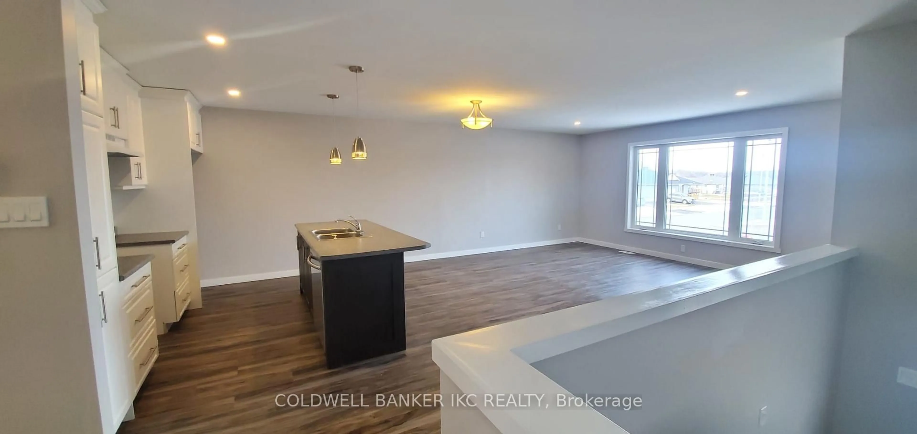 Open concept kitchen, wood/laminate floor for 240 Glen Nora Dr, Cornwall Ontario K6H 0A8