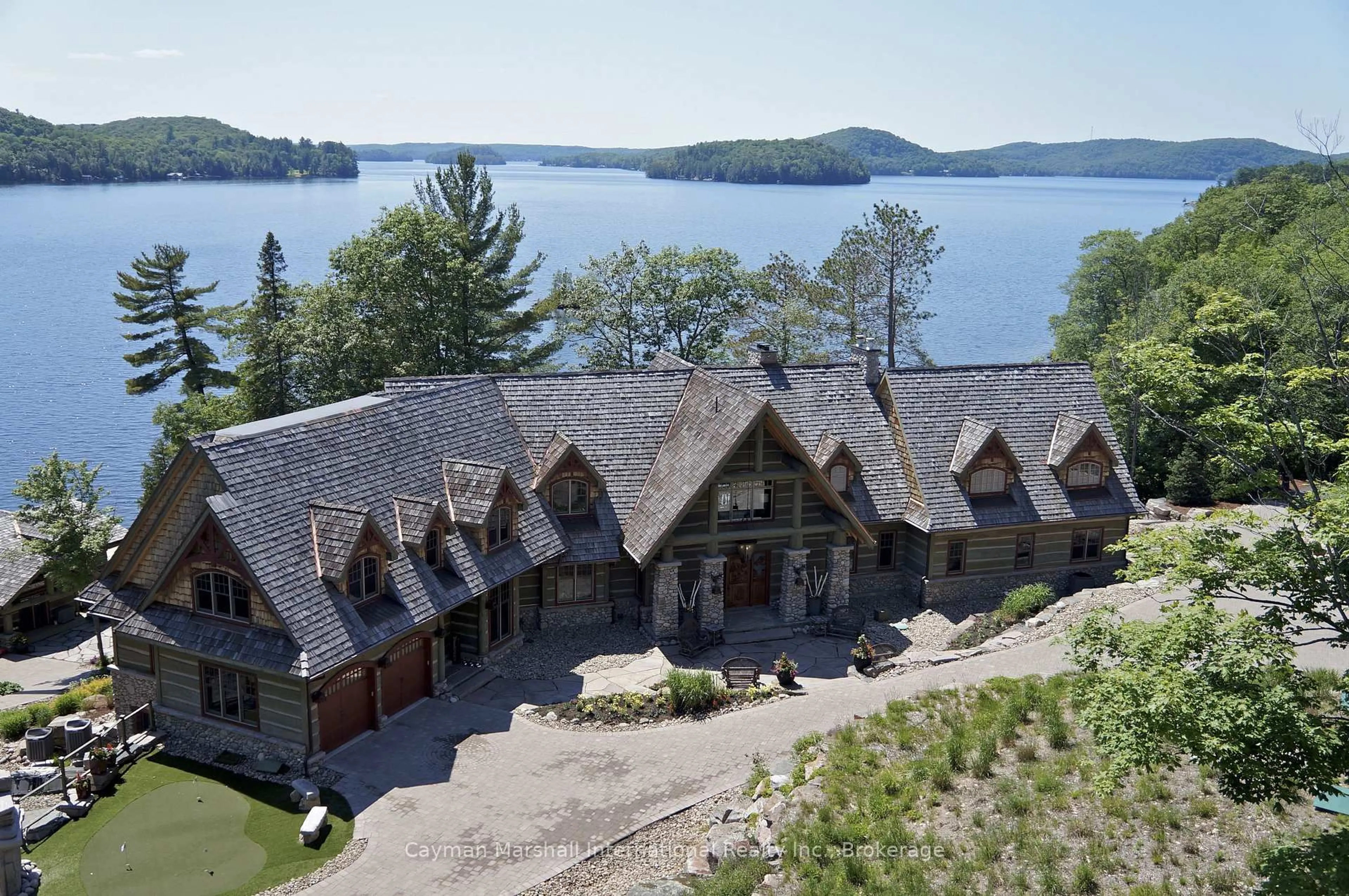 A pic from outside/outdoor area/front of a property/back of a property/a pic from drone, water/lake/river/ocean view for 1100 Delbrooke Rd #2, Lake of Bays Ontario P0A 1H0