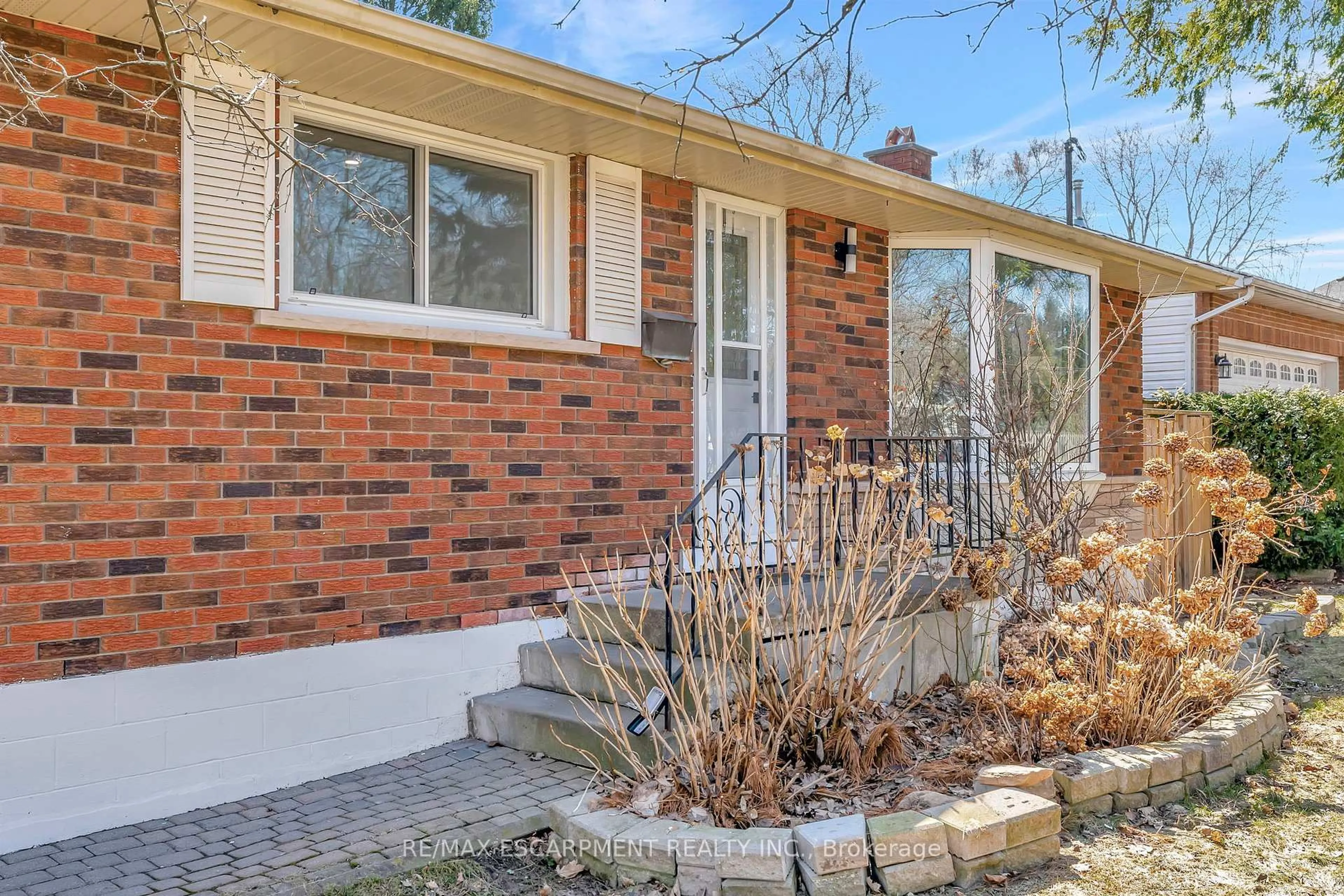Home with brick exterior material, street for 216 Sioux Rd, Hamilton Ontario L9G 1P8