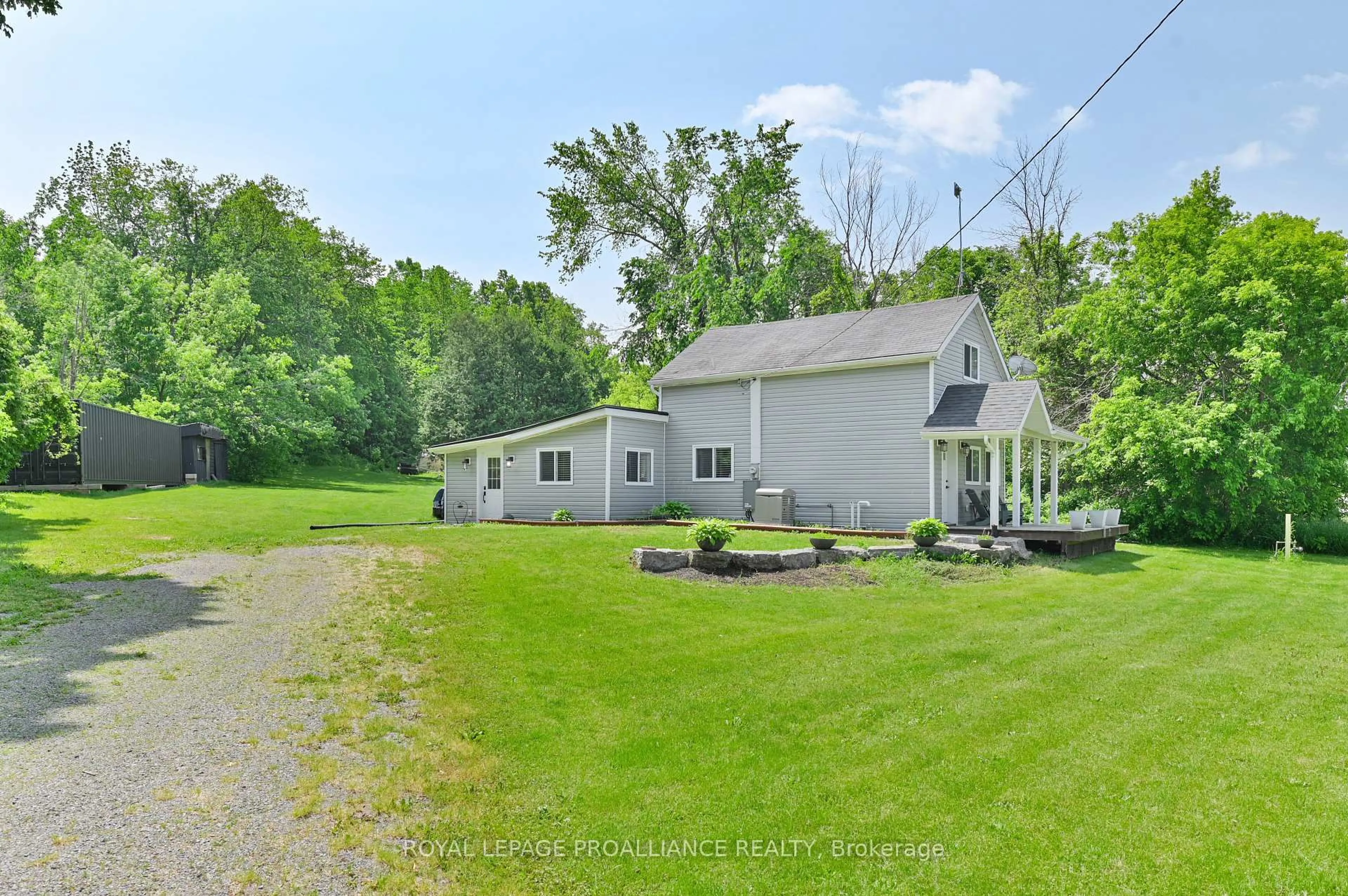 A pic from outside/outdoor area/front of a property/back of a property/a pic from drone, water/lake/river/ocean view for 11100 Highway 62, Madoc Ontario K0K 2K0