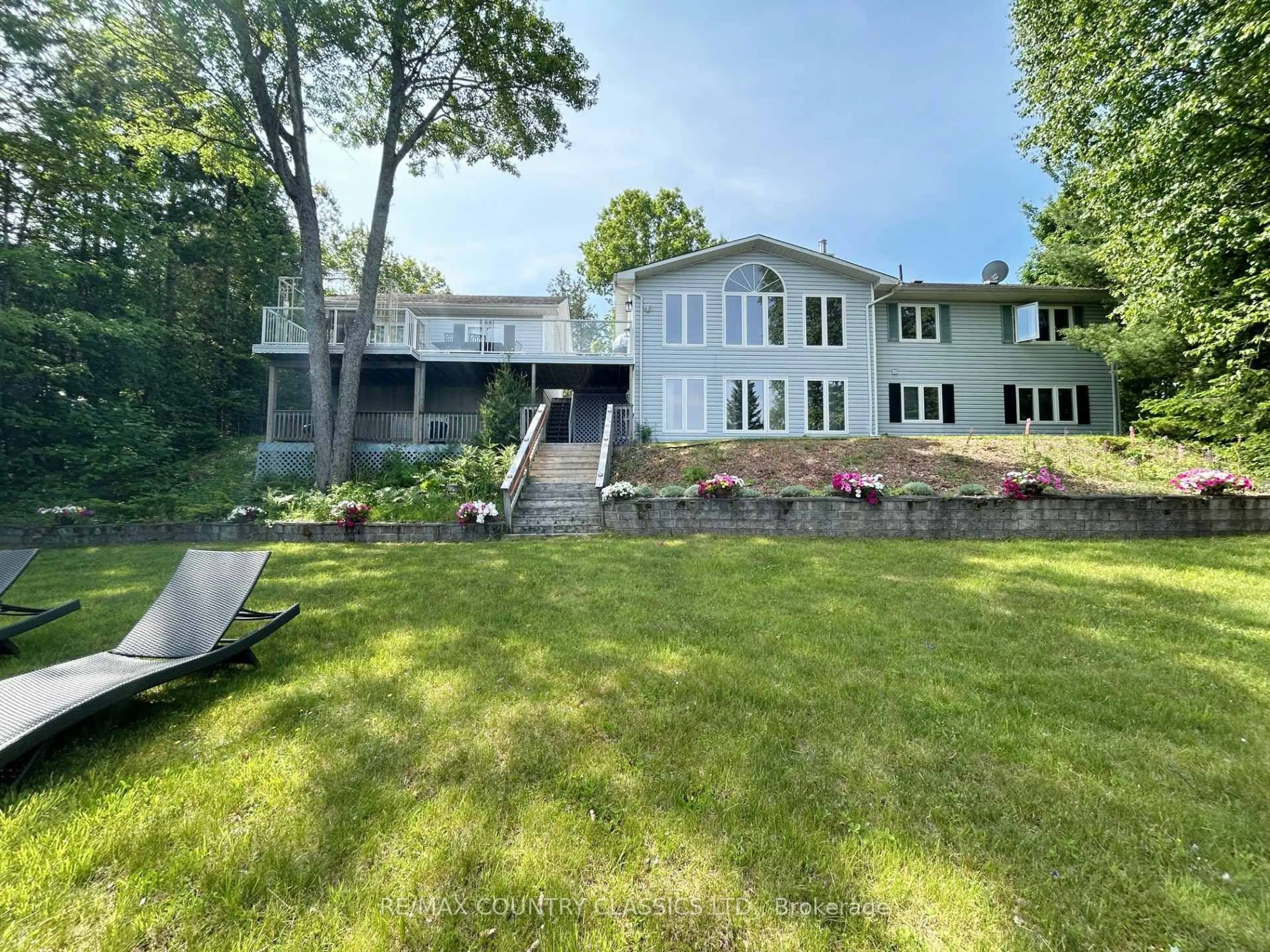 A pic from outside/outdoor area/front of a property/back of a property/a pic from drone, water/lake/river/ocean view for 112 Bay Shore Dr, Bancroft Ontario K0L 1C0