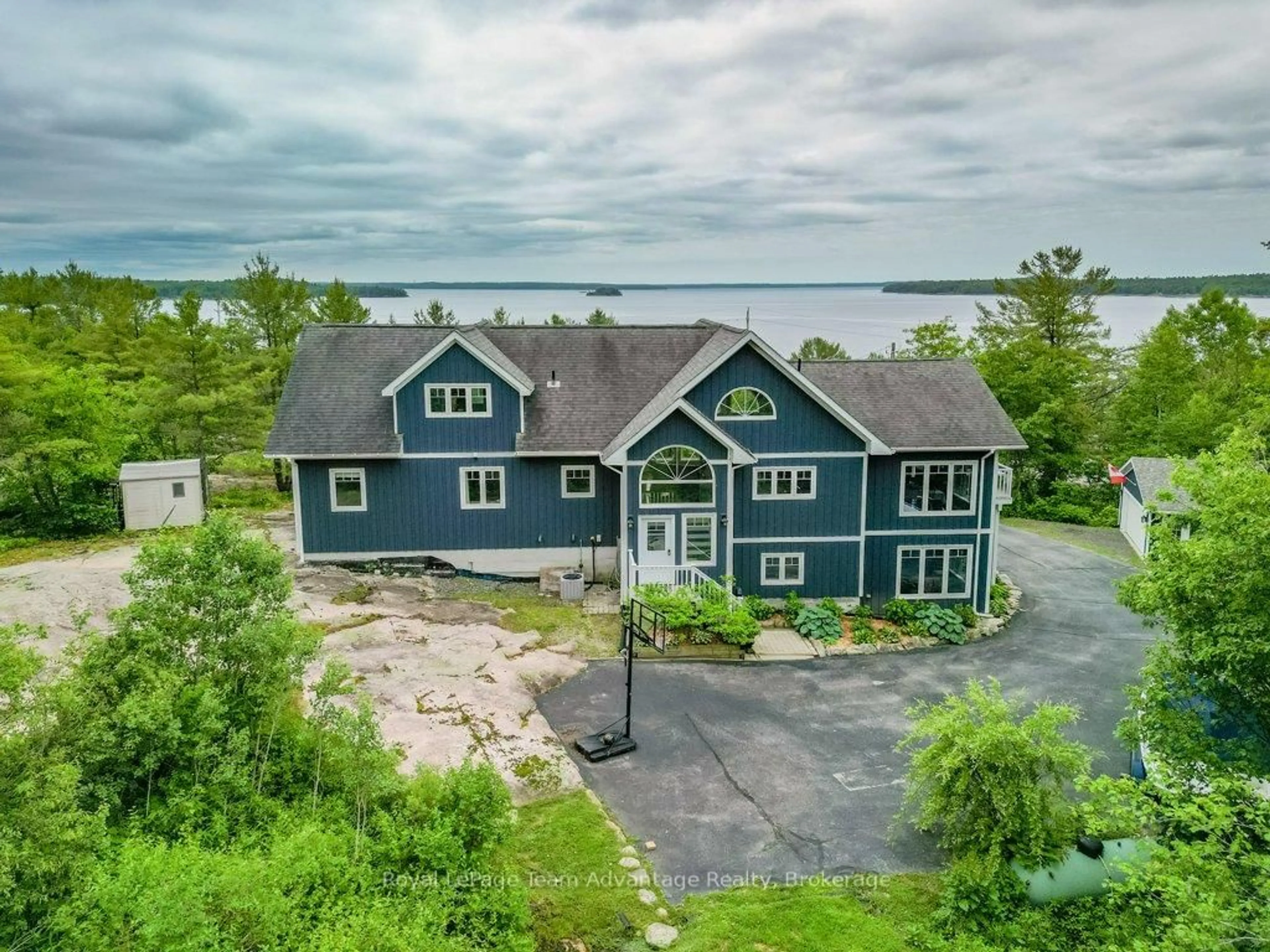 A pic from outside/outdoor area/front of a property/back of a property/a pic from drone, water/lake/river/ocean view for 39 Big Sound Rd, McDougall Ontario P0G 1G0