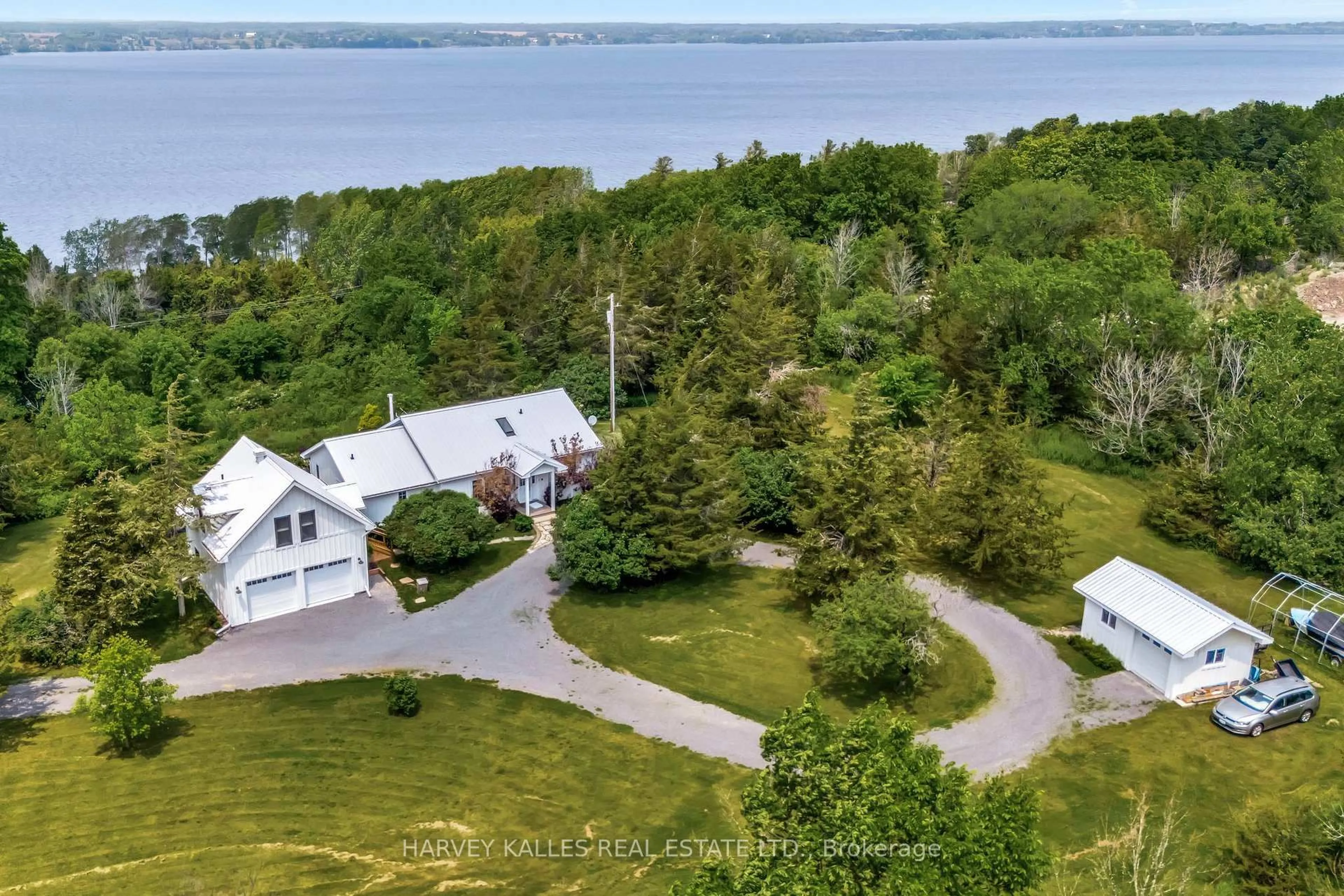 A pic from outside/outdoor area/front of a property/back of a property/a pic from drone, water/lake/river/ocean view for 2992 County Rd 7 Rd, Prince Edward County Ontario K0K 2T0