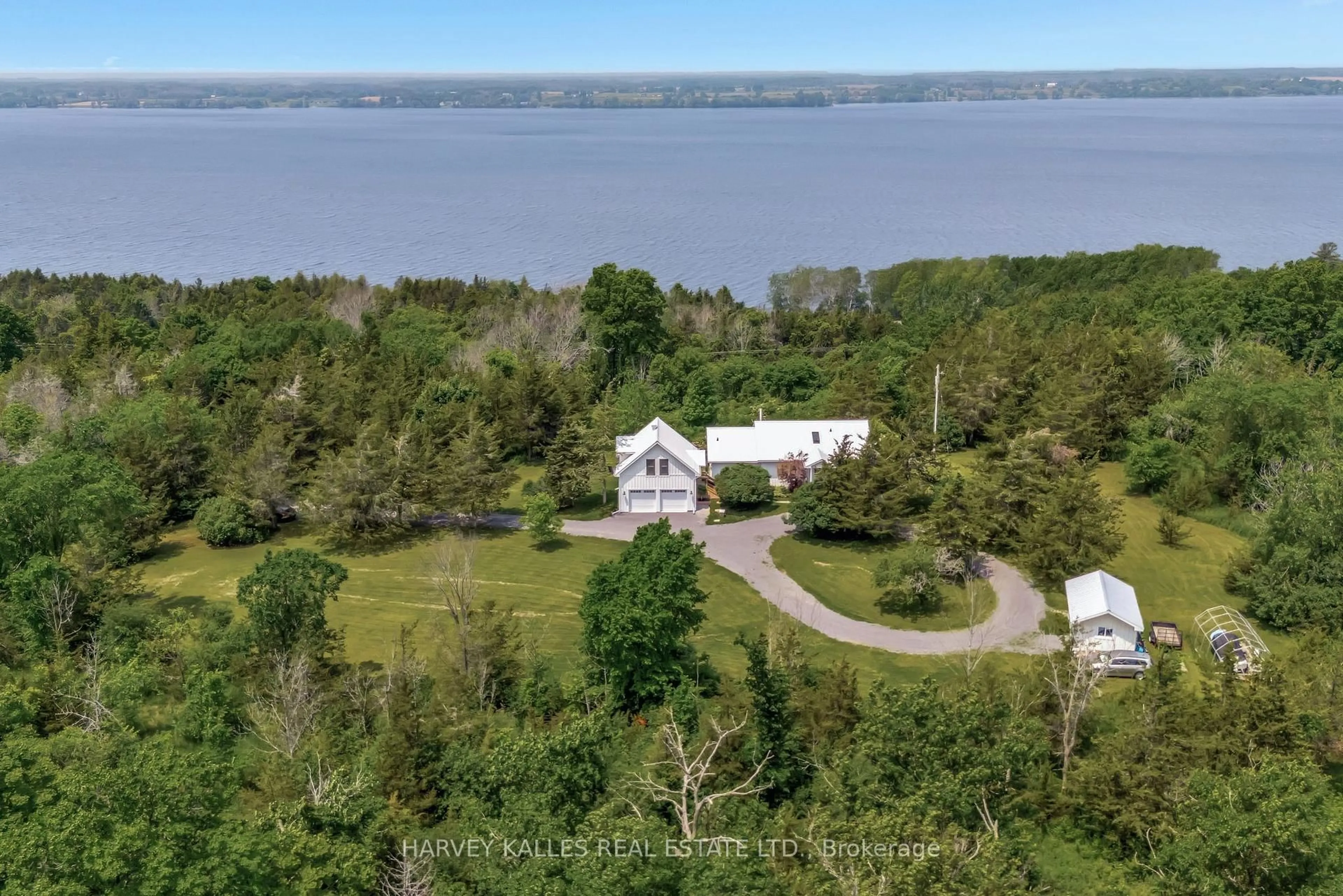 A pic from outside/outdoor area/front of a property/back of a property/a pic from drone, water/lake/river/ocean view for 2992 County Rd 7 Rd, Prince Edward County Ontario K0K 2T0