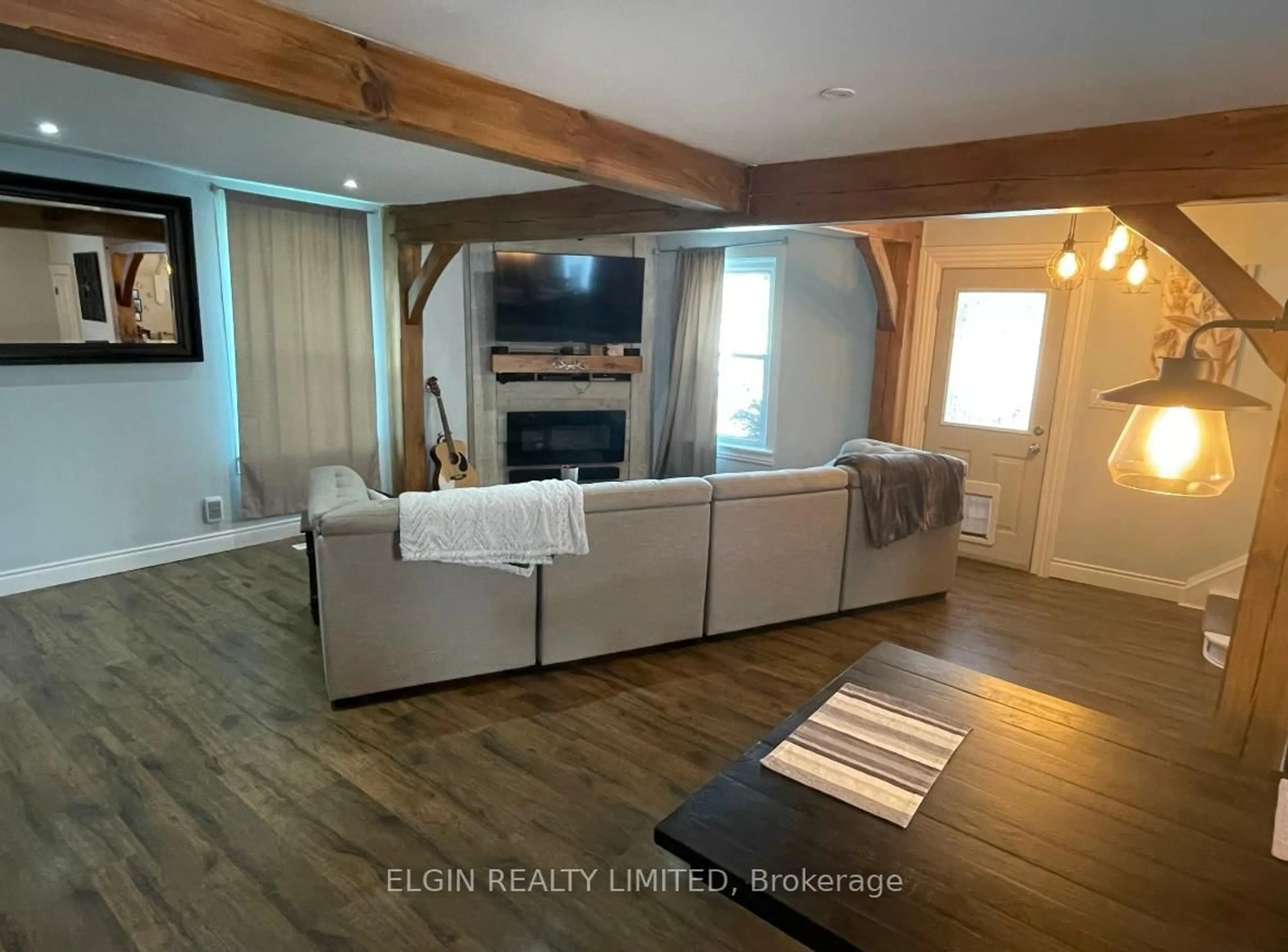 Living room with furniture, wood/laminate floor for 115 Balaclava St, St. Thomas Ontario N5P 3C8