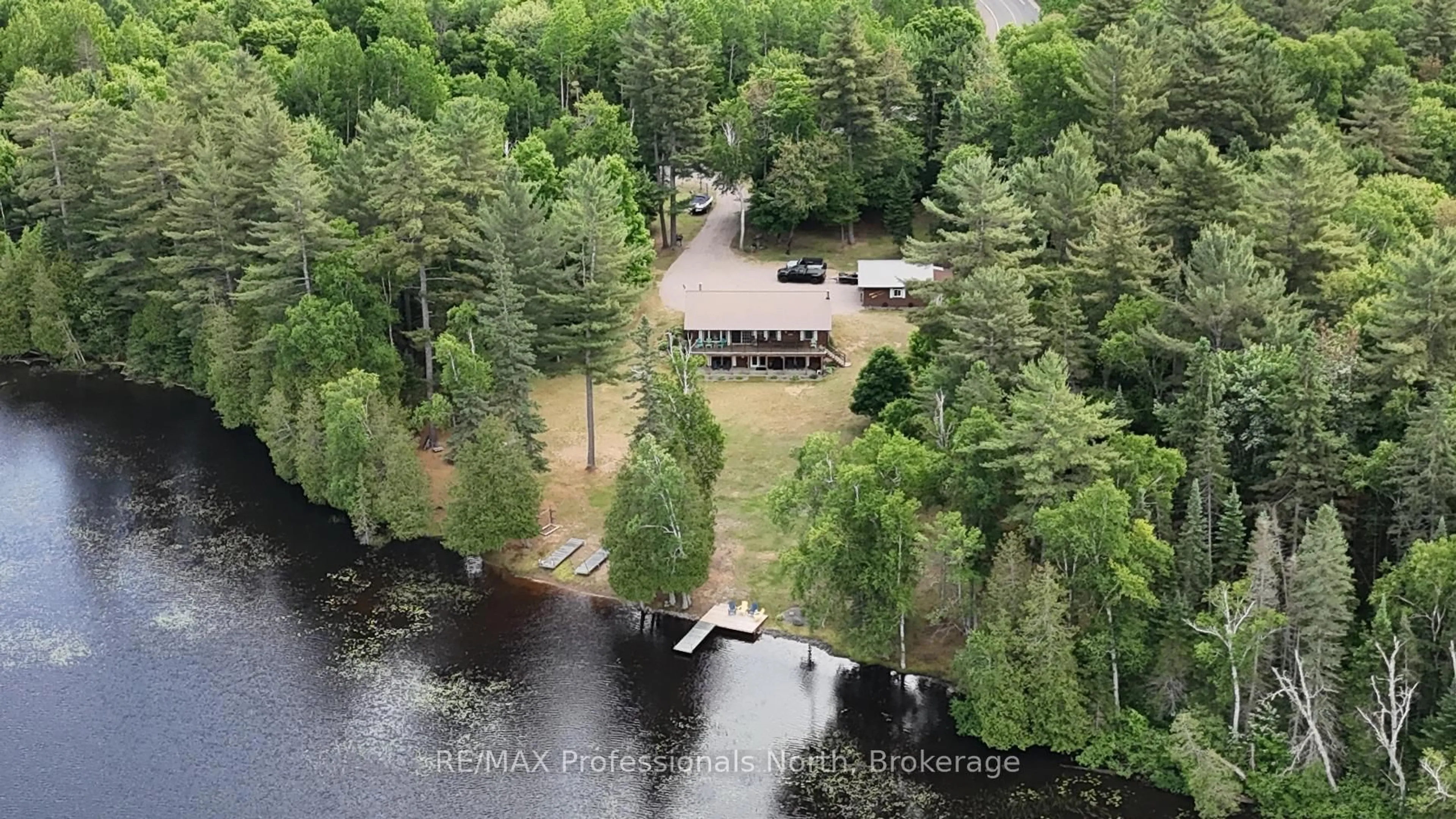 A pic from outside/outdoor area/front of a property/back of a property/a pic from drone, water/lake/river/ocean view for 3951 Elephant Lake Rd, Dysart et al Ontario K0L 1X0