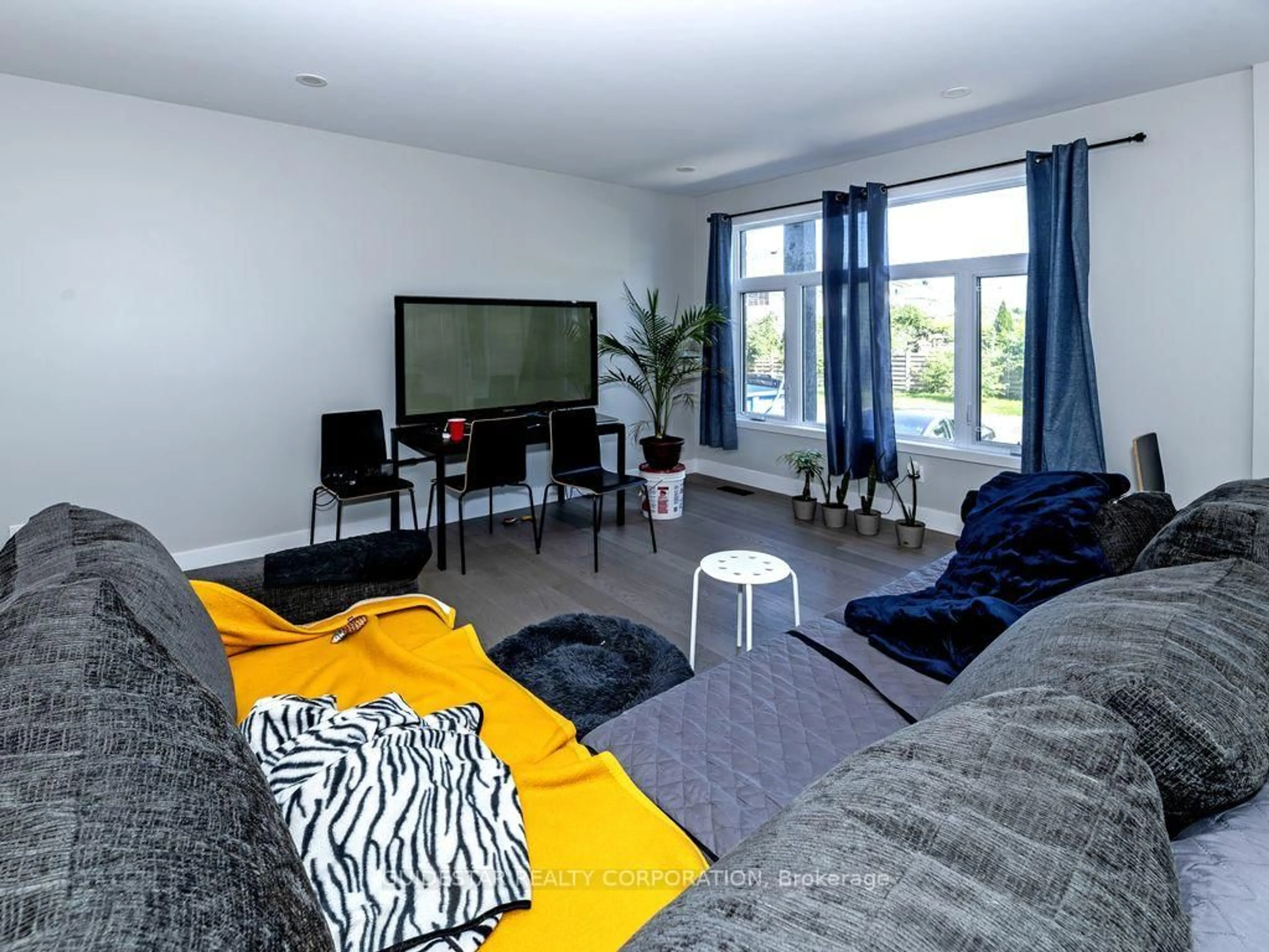 Living room with furniture, unknown for 25 Pennard Way #A & B, Ottawa Ontario K1T 4C1