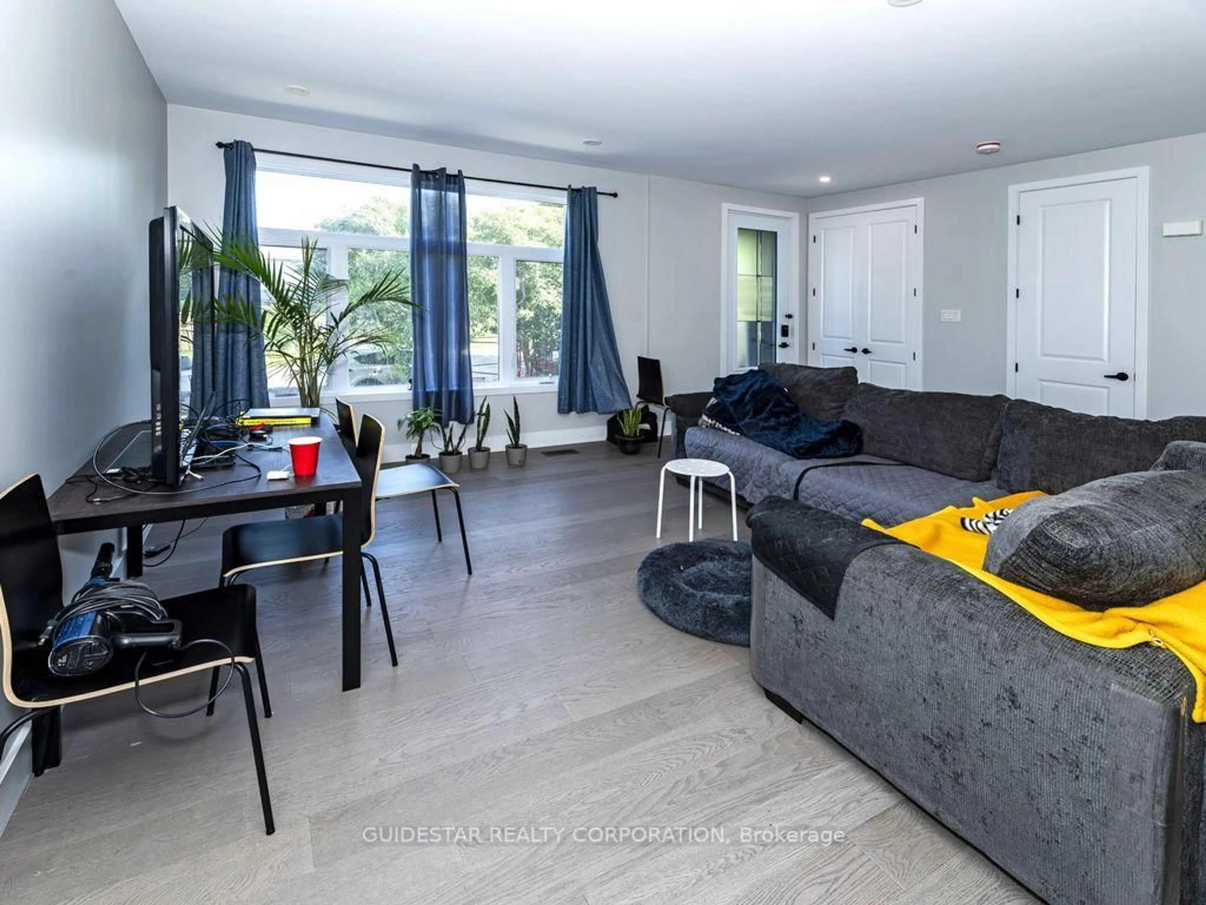 Living room with furniture, unknown for 22 Inverkip Ave #A/B, Ottawa Ontario K1T 4B7